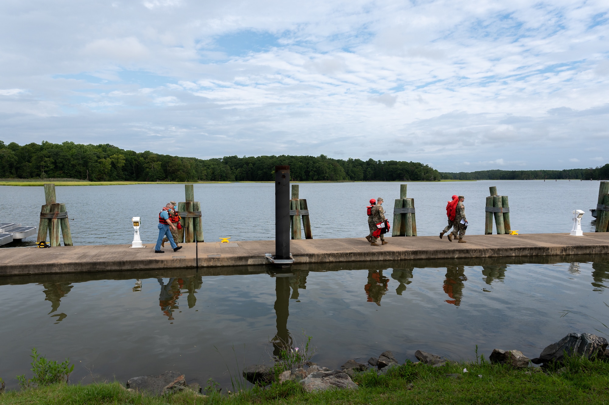 Soldiers walk across the dock at Third Port to start a fast-boat maneuvering course.