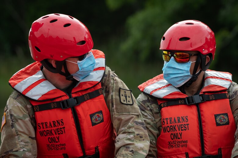Warrant Officers discuss boating maneuvers during training at Third Port on Fort Eustis.