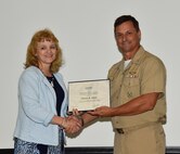 Ms. Cherie Joyce, Executive Secretary, Ocean and Atmospheric Science and Technology (OAST) Directorate, is presented the Commanding Officer’s Excellence in Secretarial Support Award by NRL Commanding Officer, CAPT Mark Bruington, at an award ceremony held at NRL, Aug. 25, 2016.