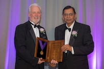 Dr. Bhakta B. Rath (r), Associate Director of Research at the U.S. Naval Research Laboratory (NRL) and head of NRL’s Materials Science and Component Technology Directorate, is awarded the Medal for the Advancement of Research by the American Society for Metals (ASM) at ASM's annual Awards Dinner held in Salt Lake City, Utah, October 25, 2016.
