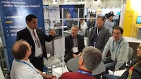 Dr. Sergio Tafur confers with other doctors, engineers, mathematicians and scientists regarding code refactoring and rewriting Navy applications for innovative computing systems during Supercomputing 2016.