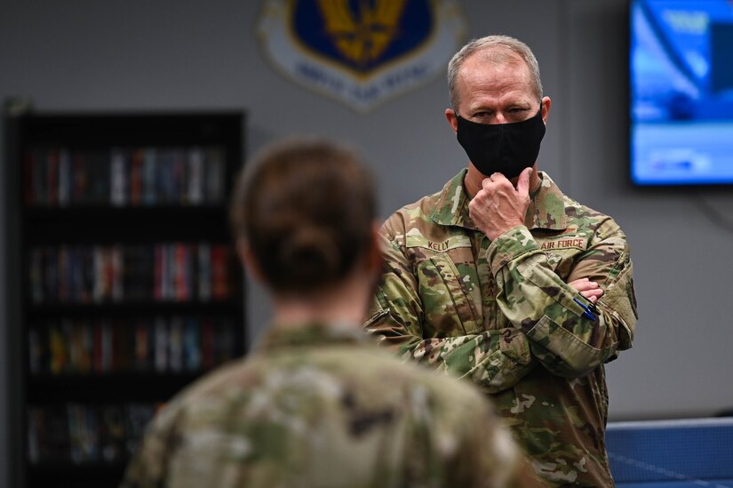 U.S. Air Force Gen. Mark Kelly, Commander of Air Combat Command, speaks with an Airman.