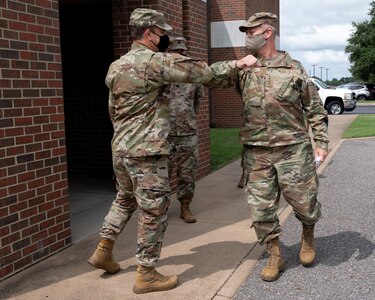 U.S. Air Force Gen. Mark Kelly, Commander of Air Combat Command, is greeted by an Airman.