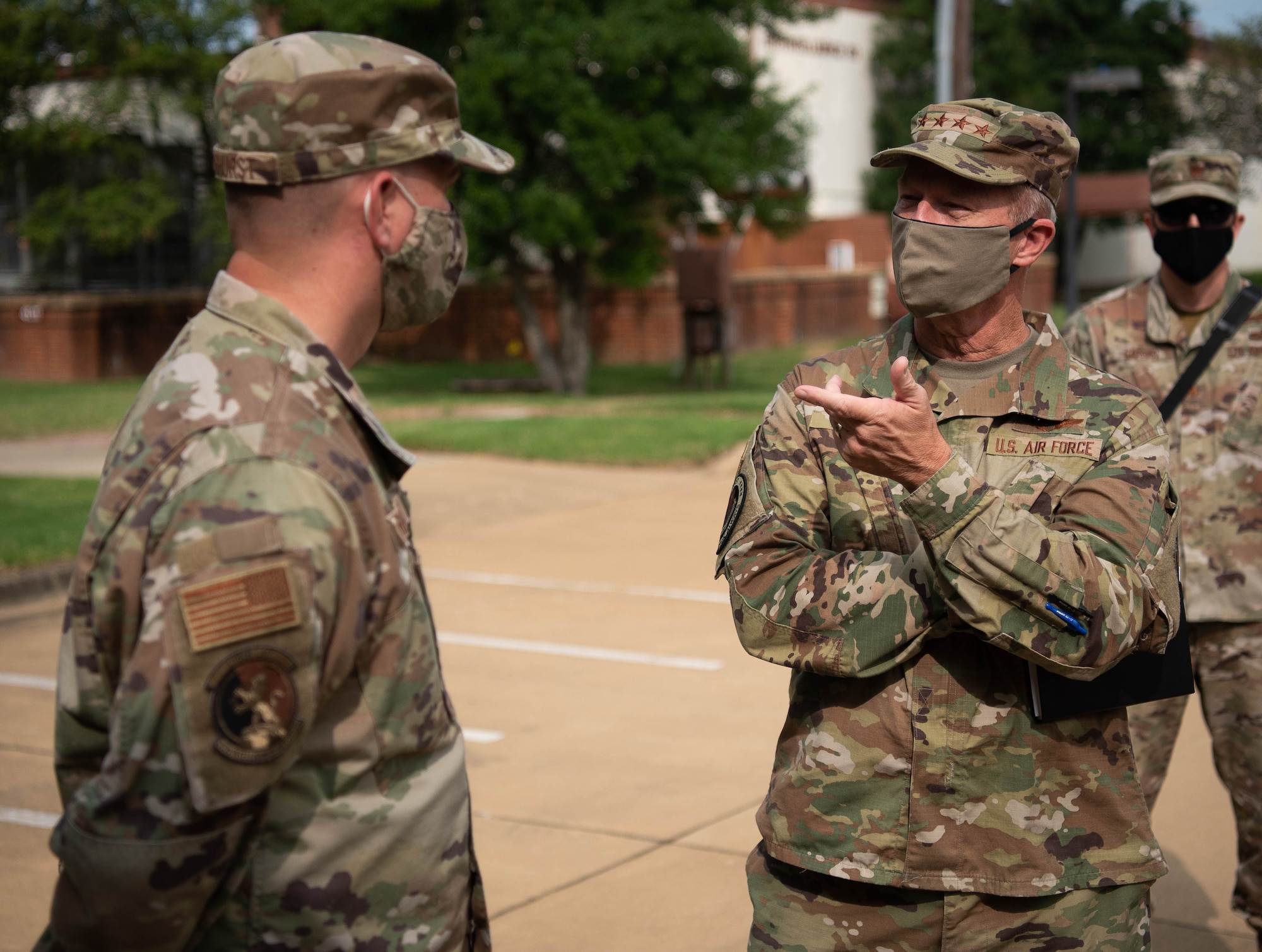 U.S. Air Force Gen. Mark Kelly, Commander of Air Combat Command, speaks with an Airman.