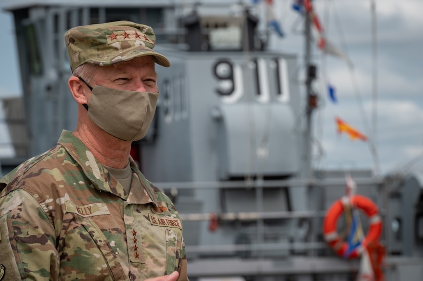 U.S. Air Force Gen. Mark Kelly, Commander of Air Combat Command, looks over the ships docked in Third Port.