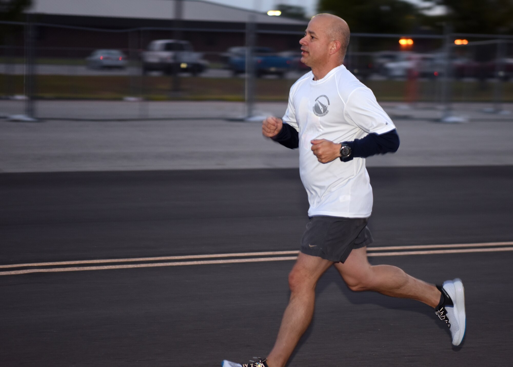 U.S. Air Force Col. Nazario, 17th Training Wing commander, runs down the flightline during the Celebration of You run on Goodfellow Air Force Base, Texas, Sept. 17, 2020. Nazario and his team encouraged students and permanent party members to keep up their hard work while he ran alongside them. (U.S. Air Force photo by Airman 1st Class Ethan Sherwood)