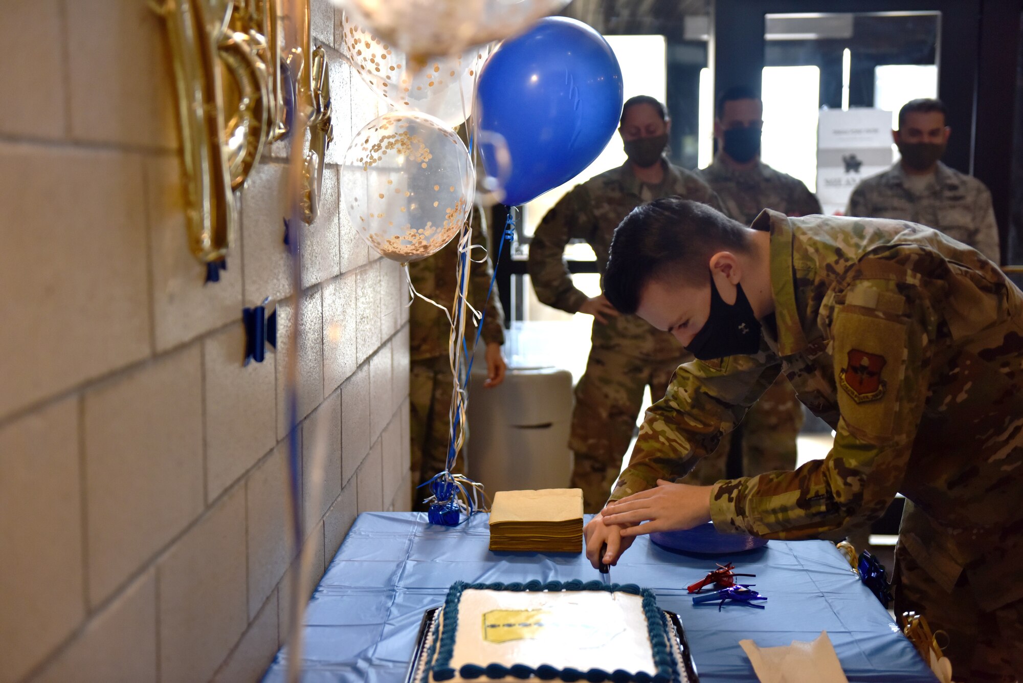 U.S. Air Force Airman 1st Class Stefan Renner, 17th Comptroller Squadron financial operations technician, cuts the Wing Staff Agencies Air Force Birthday Cake at the Norma Brown Building on Goodfellow Air Force Base, Texas, Sept. 18, 2020. Each unit held their own cake cutting ceremony as a final event from two days of celebrating the 73rd Air Force Birthday. (U.S. Air Force photo by Staff Sgt. Seraiah Wolf)