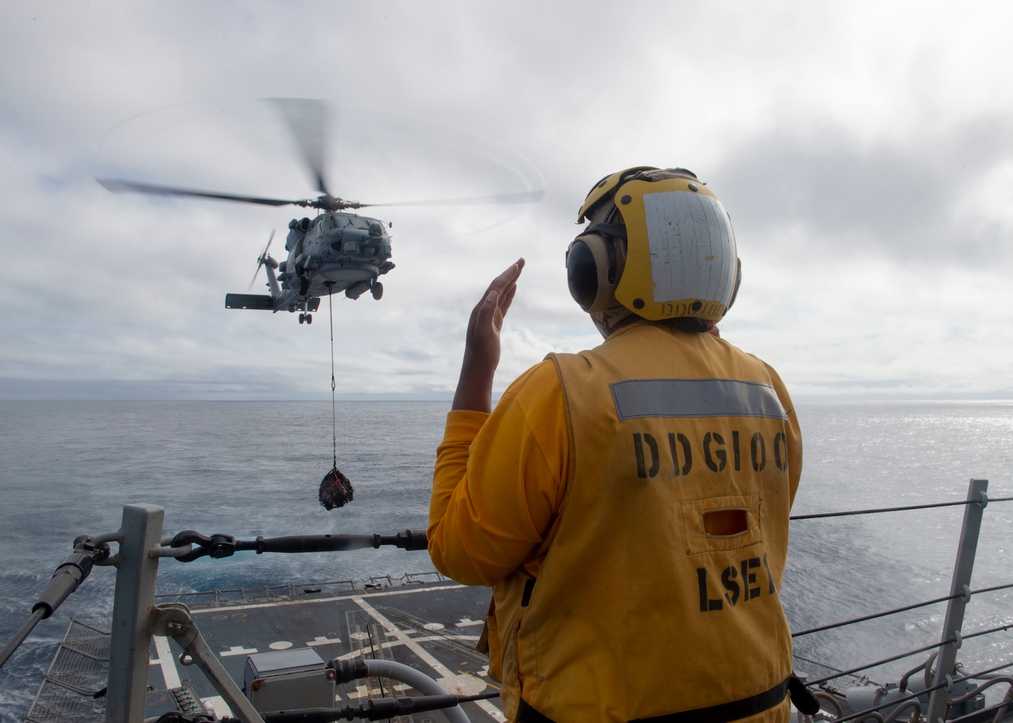 Sailor directs helicopter aboard USS Kidd