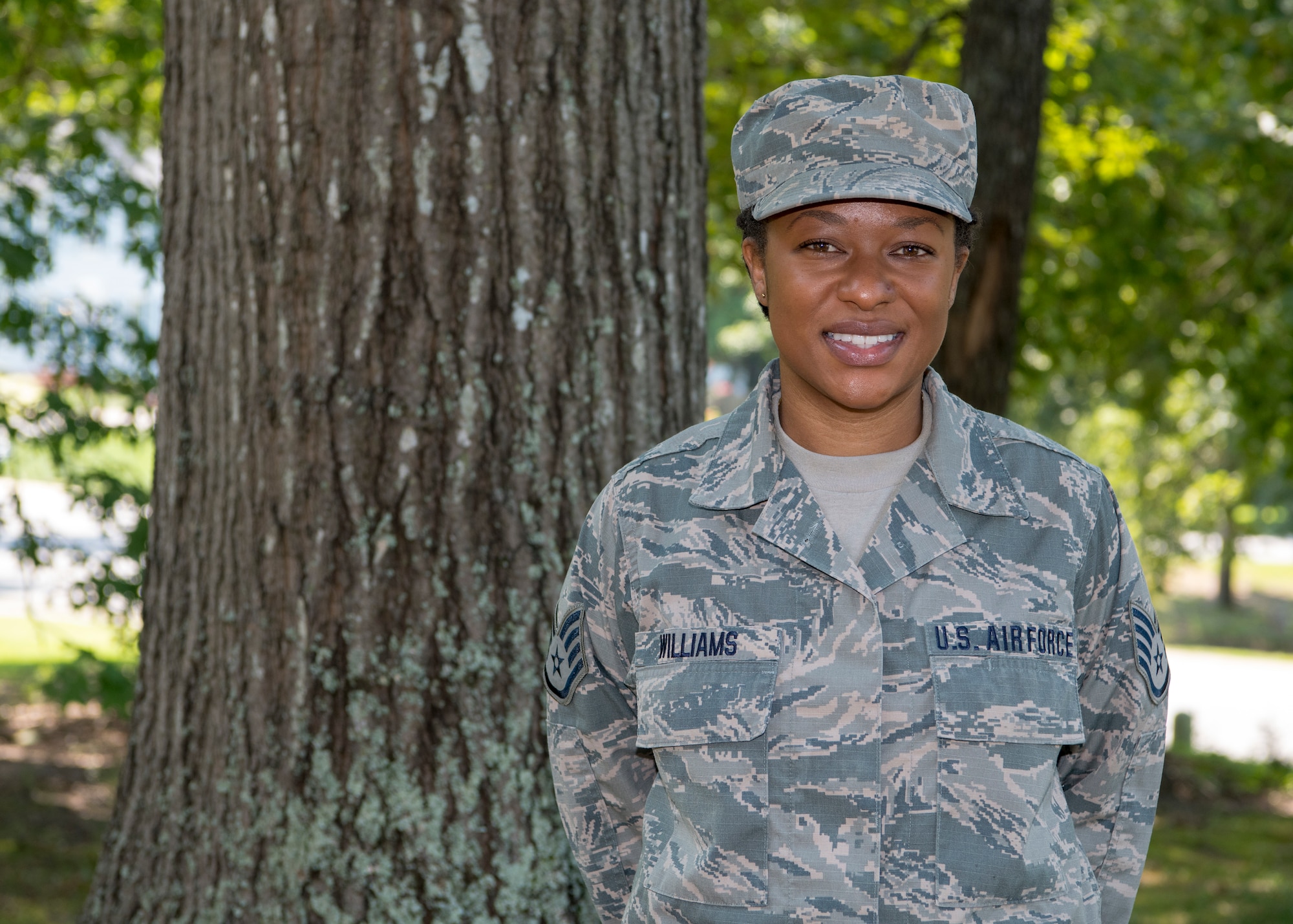 A female Airman poses for a photo