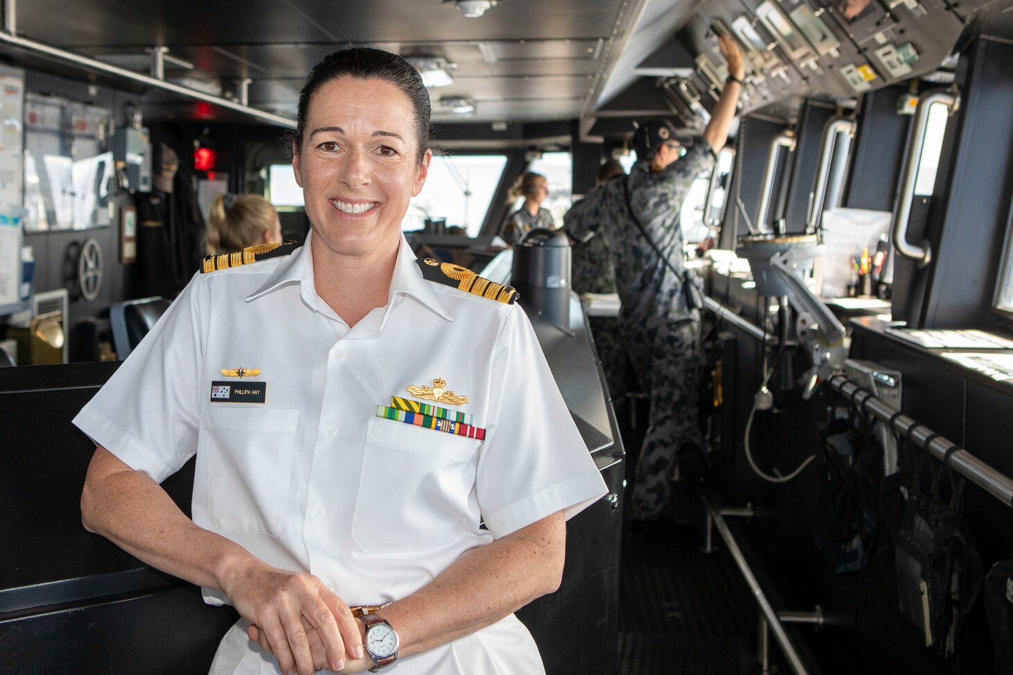 Capt. Phillipa Hay, on the bridge of Royal Australian Ship HMAS Hobart (DDG 39).