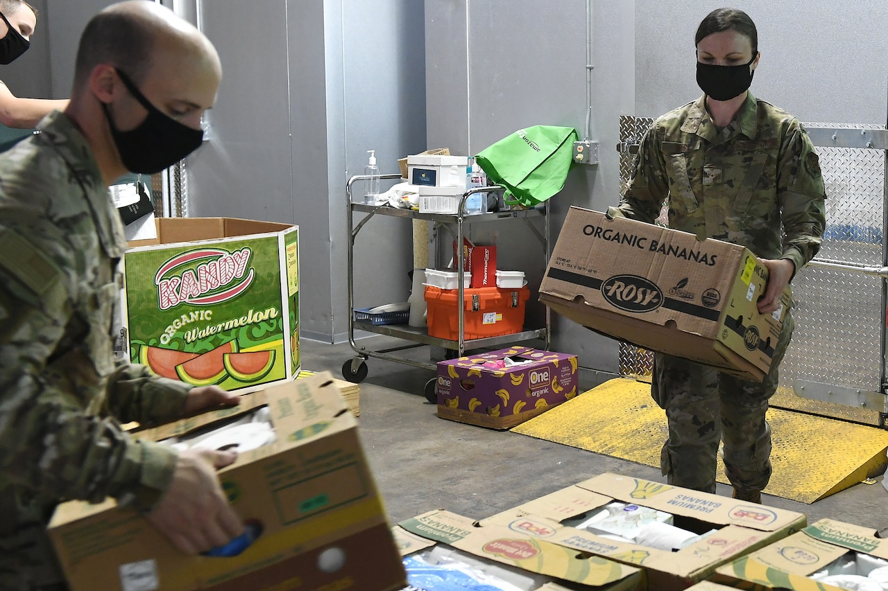 An airman working at a food bank.