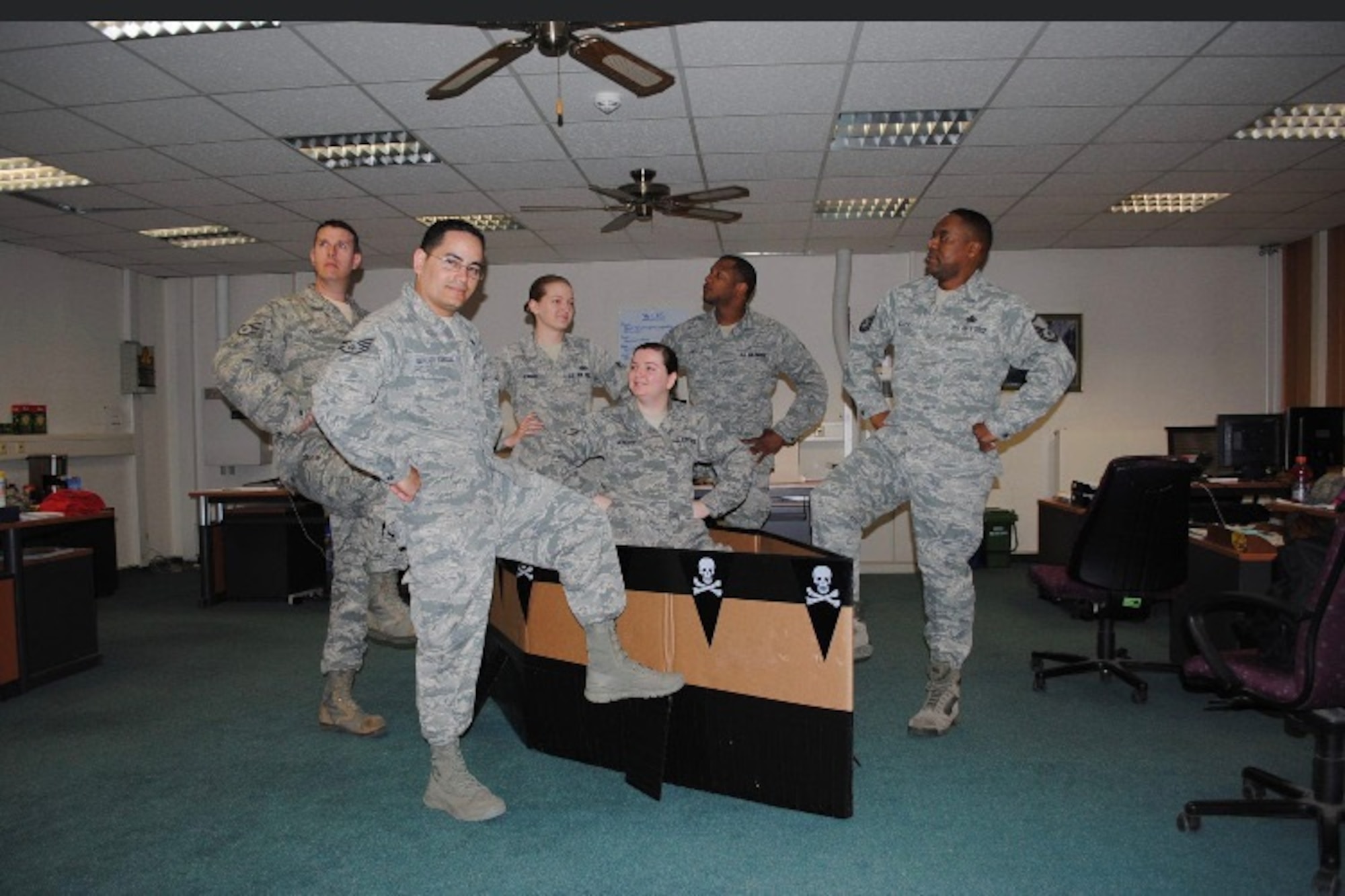 Master Sgt. Heriberto Mercado Rodriguez, 27th Special Operations Logistics Readiness Squadron C-130 aircraft parts storage section chief, at the time a staff sergeant, poses for a photo to present his team’s cardboard boat at Ramstein Air Base, Germany, 2014. Ramstein was Mercado’s first base. (Courtesy Photo)