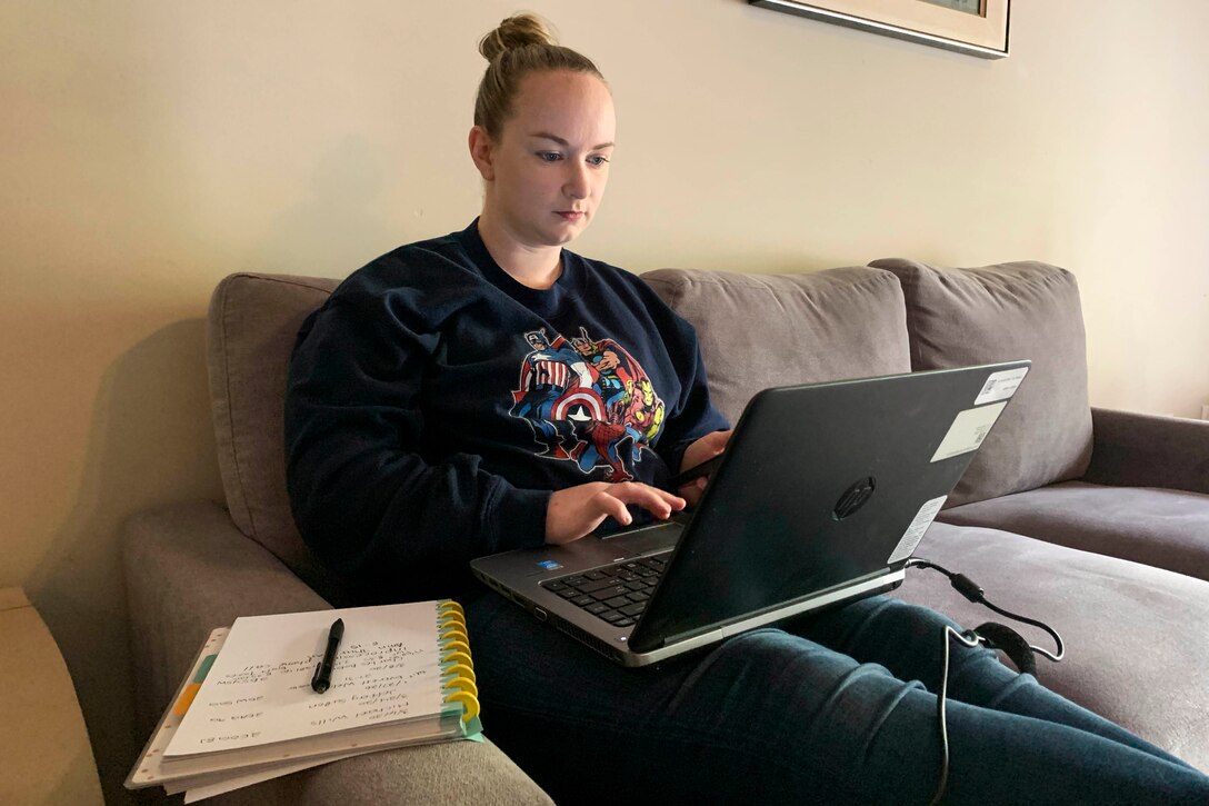 A woman works at a computer