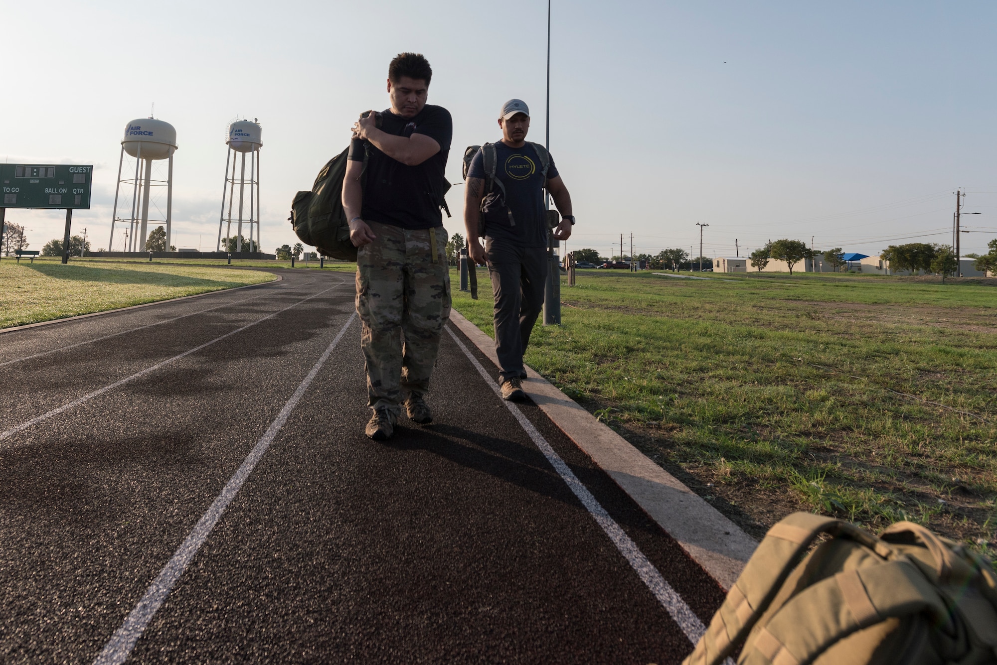 Participants adjust their gear before starting the ruck competition that was held on base in celebration of the Air Force’s 73rd birthday on Sept. 18, 2020, at Laughlin Air Force Base, Texas. The wing hosted a ruck competition following a dissimilar formation flyover and playing of the Air Force song. (U.S Air Force photo by Senior Airman Anne McCready)