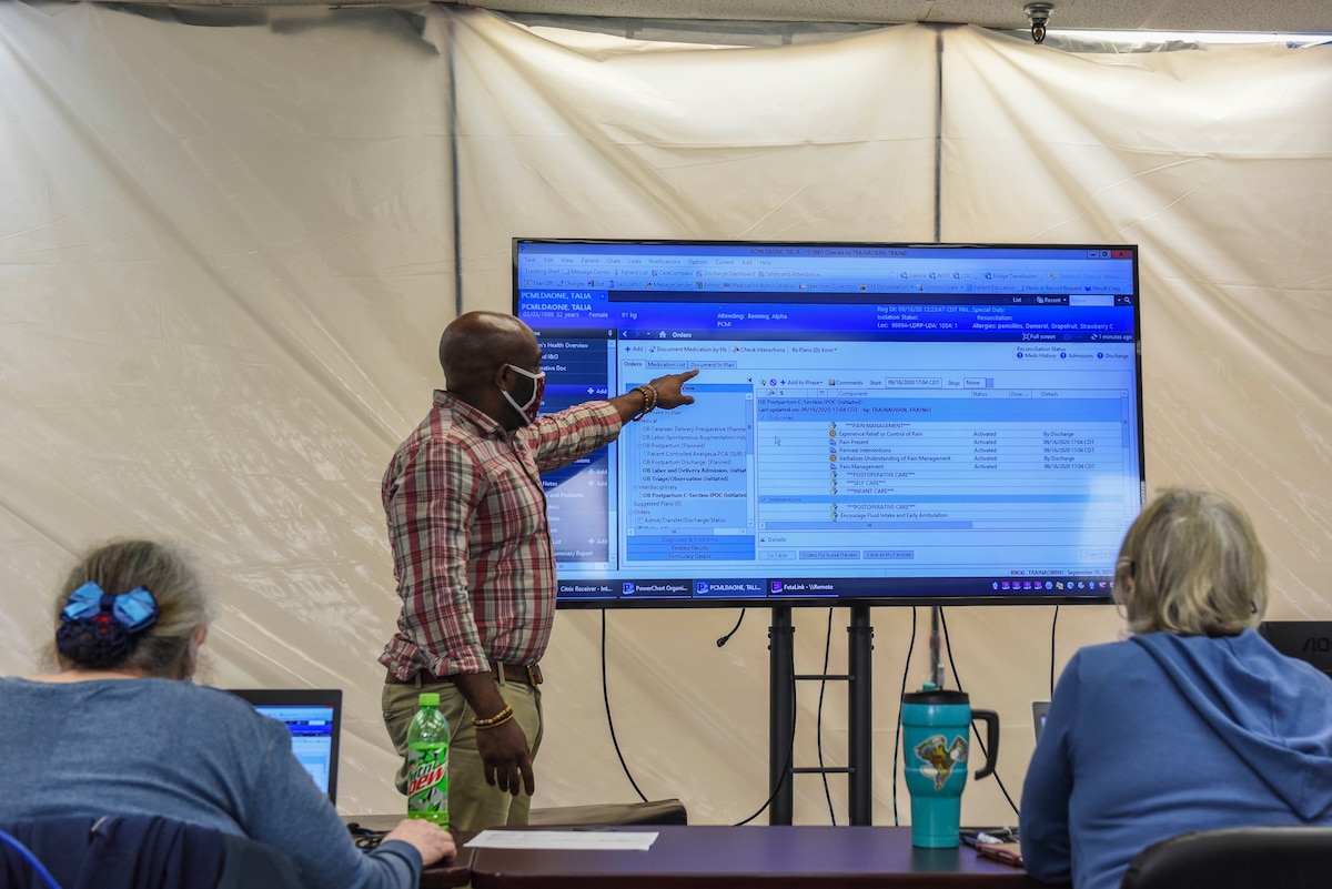 A Military Health System GENESIS trainer demonstrates how to operate the system at Eielson Air Force Base, Alaska, Sept. 16, 2020.