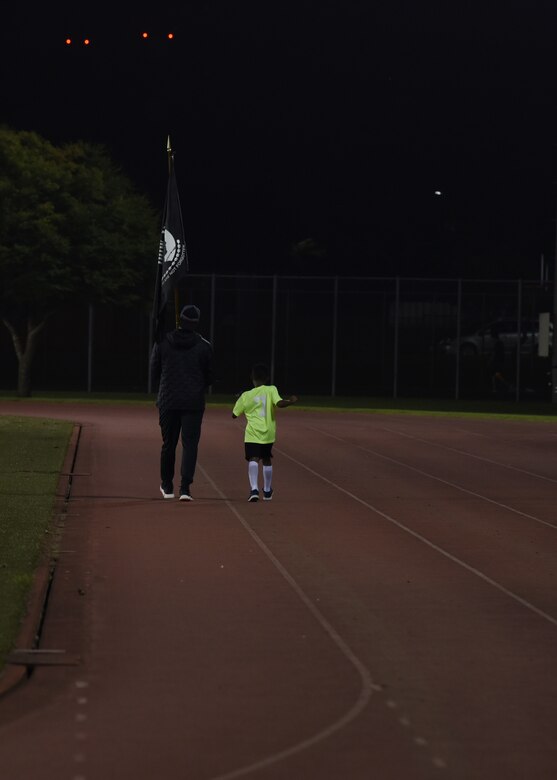 Members of Team Misawa participate in a 24-hour ruck to pay homage to those missing and to those who gave the ultimate sacrifice during National Prisoner of War/Missing in Action Recognition Day at Misawa Air Base, Japan, Sept. 17, 2020. POW/MIA Recognition Day is traditionally held on the third Friday in September.  (U.S. Air Force photo by Staff Sgt. Grace Nichols)