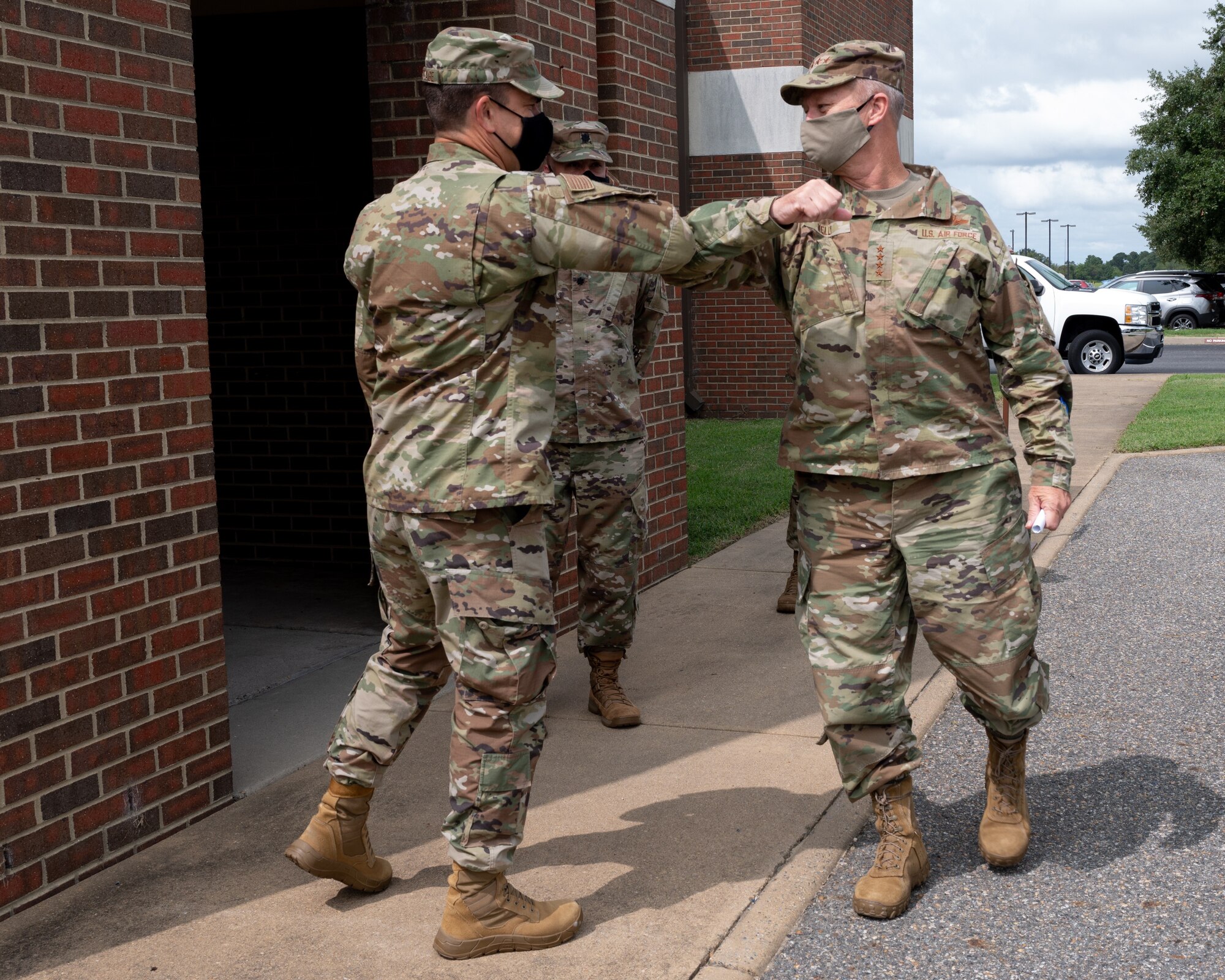 U.S. Air Force Gen. Mark Kelly, Commander of Air Combat Command, is greeted by an Airman.