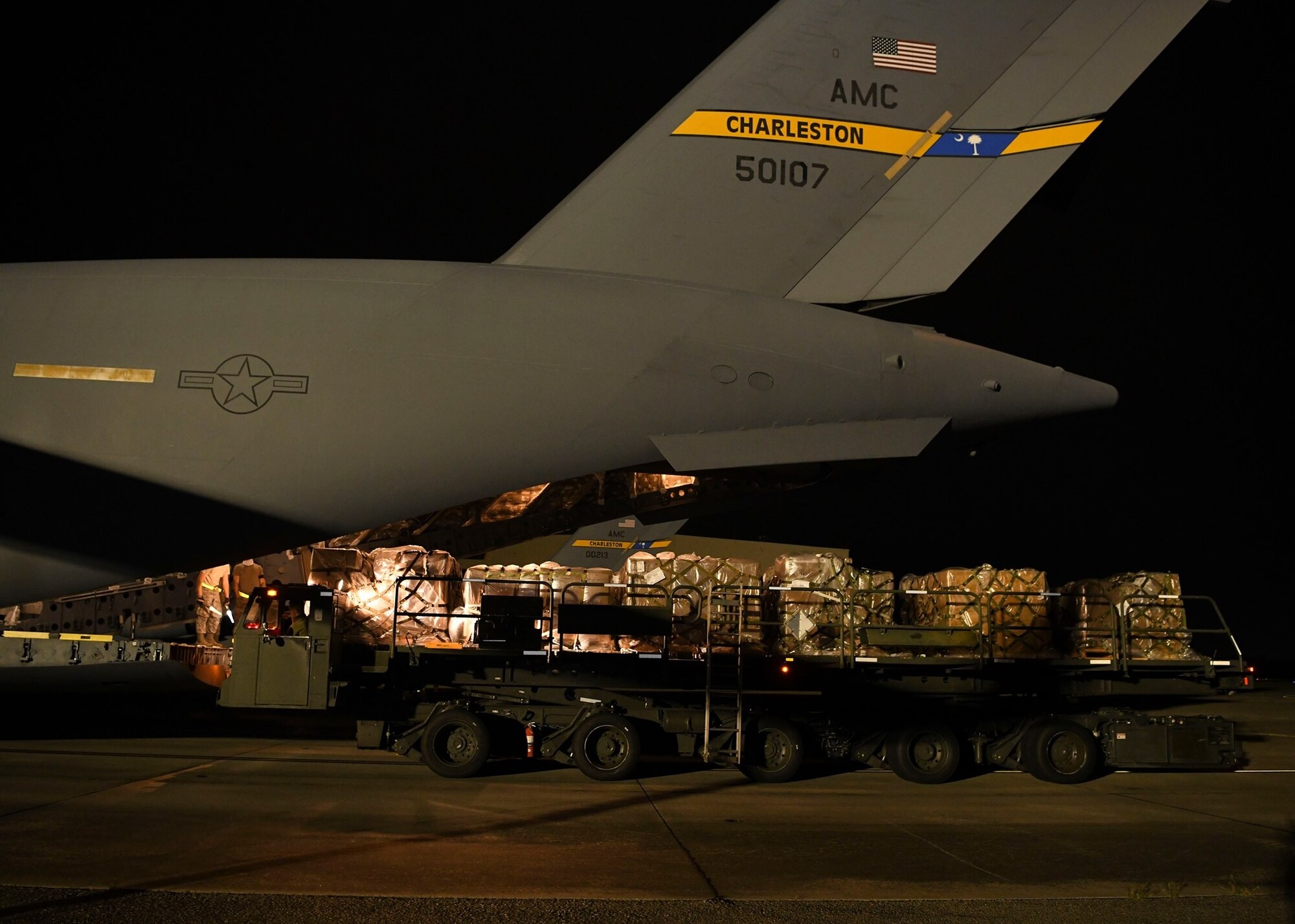 Ramp service technicians assigned to the 437th Aerial Port Squadron load a mobile field hospital onto a C-17 Globemaster III at Joint Base Charleston, S.C., Sept. 19, 2020. Aircrew assigned to the 15th Airlift Squadron transported the large mobile hospital to Kingston, Jamaica, Sept. 19, where it will be used to support the Caribbean nation’s ongoing response to the COVID-19 pandemic. The donation, made on behalf of the American people, cost $753,000 and is part of U.S. Southern Command’s ongoing assistance to nations responding to the global pandemic in the Caribbean and Latin America funded by the command’s Humanitarian Assistance Program (HAP). The command has also delivered mobile field hospitals to Costa Rica and the Dominican Republic and, in total, will donate 24 field hospitals to 11 countries. (Photo by Staff Sergeant Lance Valencia)
