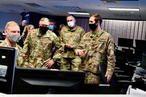 U.S. Army Maj. Gen. Bret Daugherty, adjutant general, Washington National Guard, second from left, and U.S. Air Force Brig. Gen. Gent Welsh, commander, Washington Air National Guard, second from right, observe software demonstrations during an Advanced Battle Management System (ABMS) onramp event at Joint Base Lewis-McChord, Wash., Sept. 2-3, 2020.