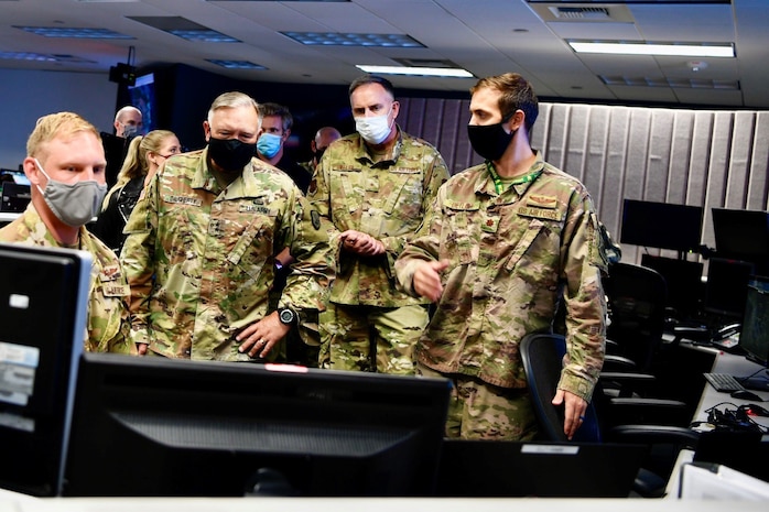 U.S. Army Maj. Gen. Bret Daugherty, adjutant general, Washington National Guard, second from left, and U.S. Air Force Brig. Gen. Gent Welsh, commander, Washington Air National Guard, second from right, observe software demonstrations during an Advanced Battle Management System (ABMS) onramp event at Joint Base Lewis-McChord, Wash., Sept. 2-3, 2020.