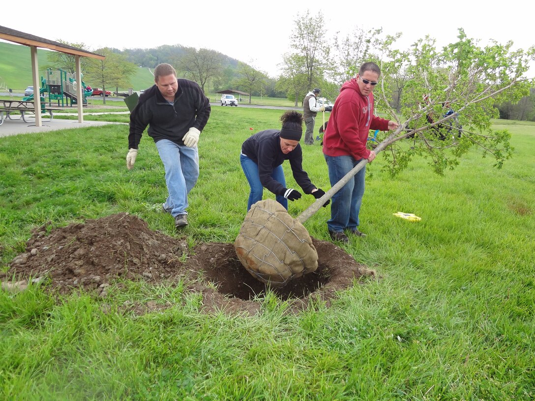 People planting trees.