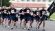 Members of the Air Force Sergeants Association Chapter 1552 run in formation during the last few minutes of the 24-hour ruck as part of the National Prisoner of War/Missing in Action Recognition Day ceremony at Misawa Air Base, Japan, Sept. 18, 2020. The AFSA chapter organized the event with help from other agencies on Misawa. (U.S. Air Force photo by Staff Sgt. Grace Nichols)