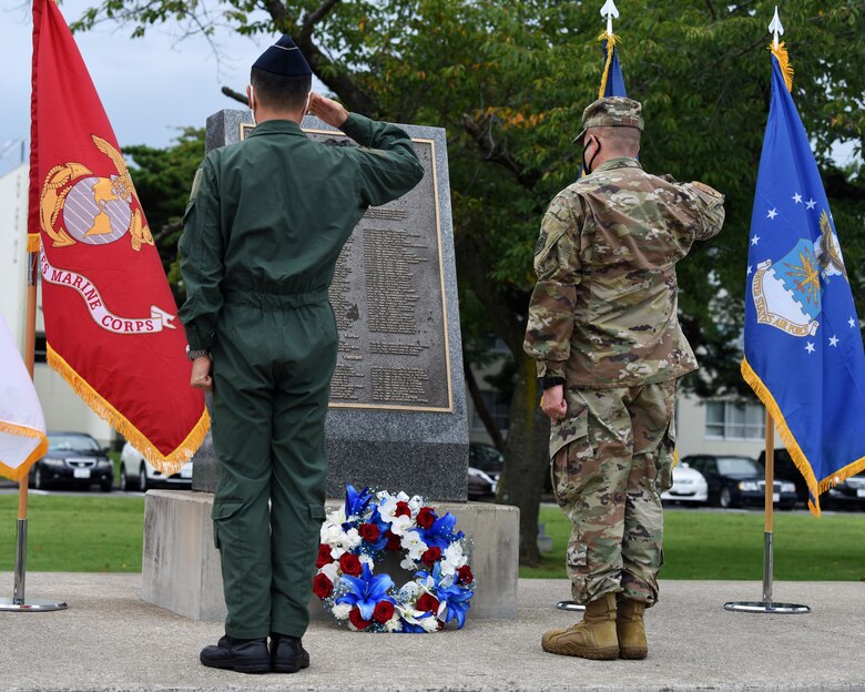 Japan Air Self Defense Force Maj. Gen. Takahiro Kubota, left, 3rd Air Wing commander, and U.S. Air Force Col. Jesse Friedel, right, 35th Fighter Wing commander, salute a wreath to honor prisoners of war and those missing in action during the National POW/MIA Recognition Day ceremony at Misawa Air Base, Japan, Sept. 18, 2020.  Since World War I, approximately 83,400 U.S. service members are still unaccounted for, and more than 150,000 Americans have been held as prisoners of war. (U.S. Air Force photo by Staff Sgt. Grace Nichols)