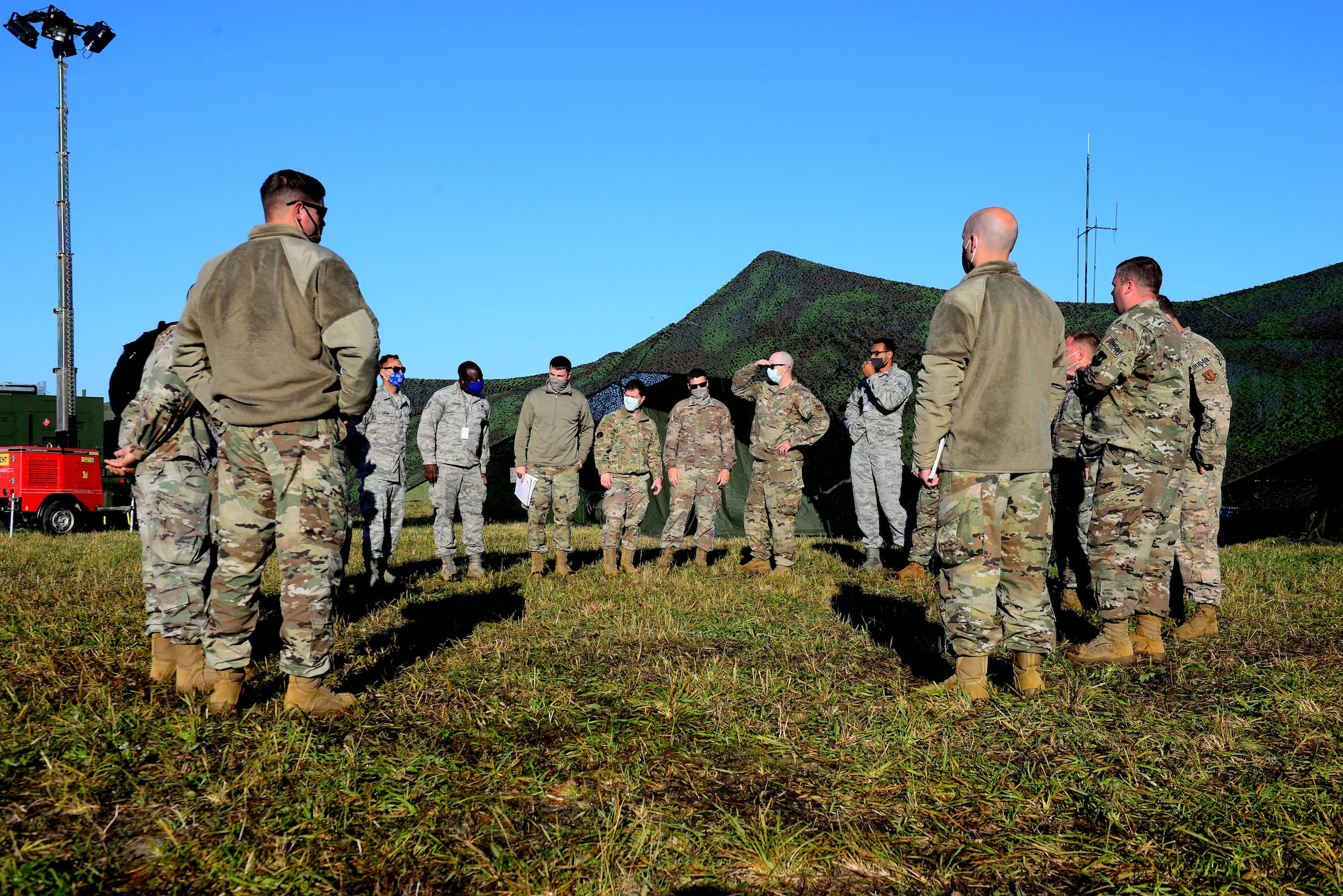 Members of the 606th Air Control Squadron conduct a morning brief during exercise Astral Knight 20 at Malbork Air Base, Poland, Sept. 21, 2020. Astral Knight 20 is a joint, multinational exercise involving Airmen and Soldiers from the United States working with service members from Poland, Latvia, Lithuania, Estonia, and Sweden. (U.S. Air Force photo by Tech. Sgt. Tory Cusimano)