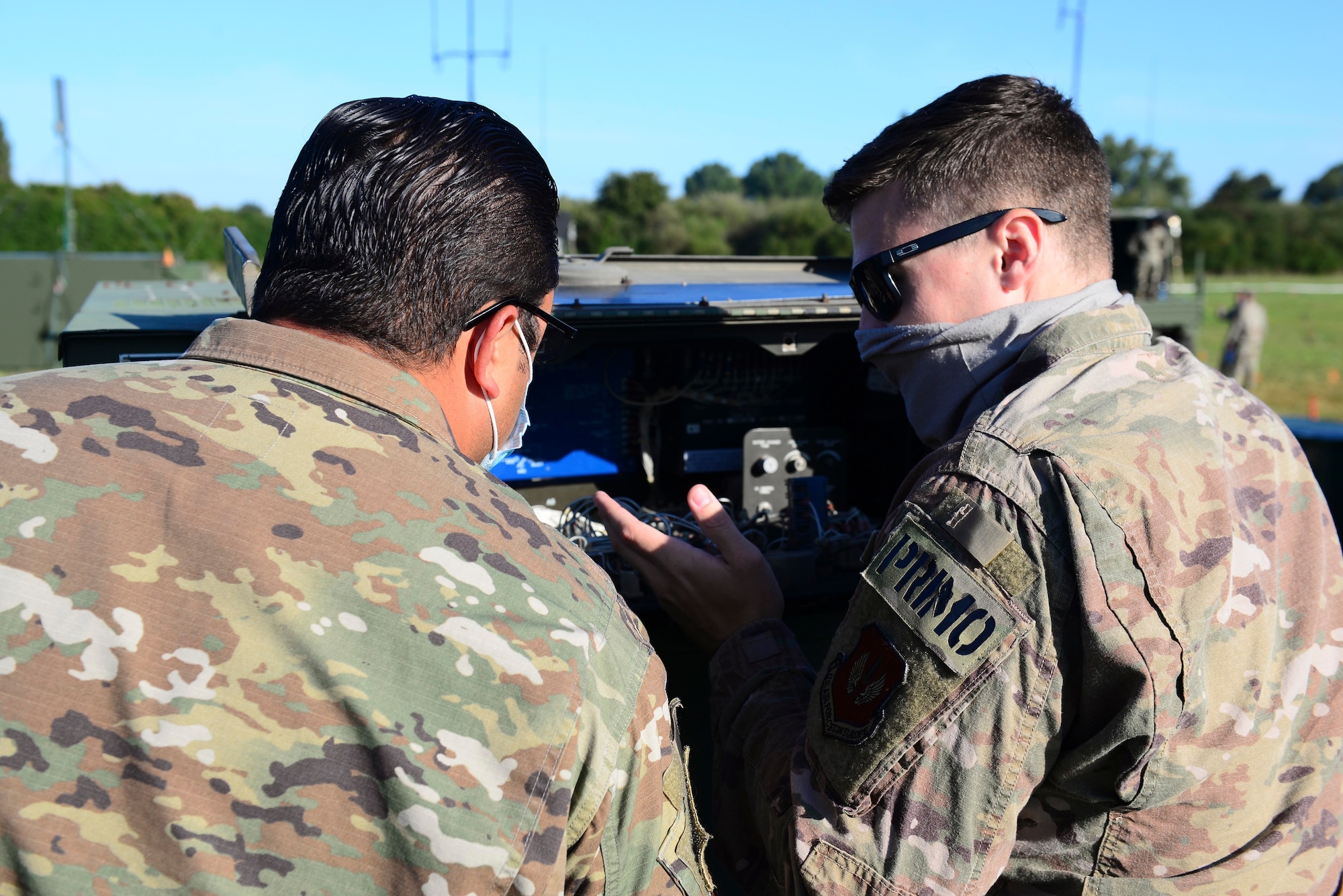 U.S. Air Force Master Sgt. Siliatu Lealiifano, 606th Air Control Squadron mission support flight chief, left, and Senior Airman Hunter Rickett, 606th ACS power pro technician, right, conduct daily checks on 806A power plants during exercise Astral Knight 20 at Malbork Air Base, Poland, Sept. 21, 2020. The plants provide power to a variety of mission-essential equipment at the 606th ACS site. (U.S. Air Force photo by Tech. Sgt. Tory Cusimano)