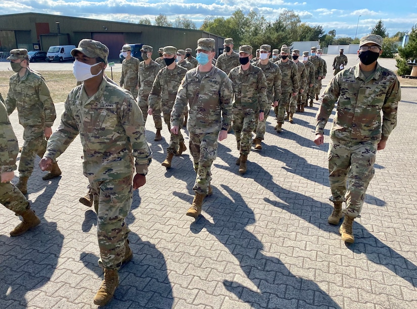 Inbound Soldiers from the United States to Europe, march to lunch at the Deployment Processing Center, Rhine Ordnance Barracks in Kaiserslautern, Germany September 11, 2020. The DPC currently houses incoming personnel from the United States undergoing quarantine and in-processing to the European theater. Task Force Willkommen is a group of organizations facilitating this process during the COVID-19 pandemic. (U.S. Army Reserve photo by Sgt. 1st Class Rick Scavetta/Released)