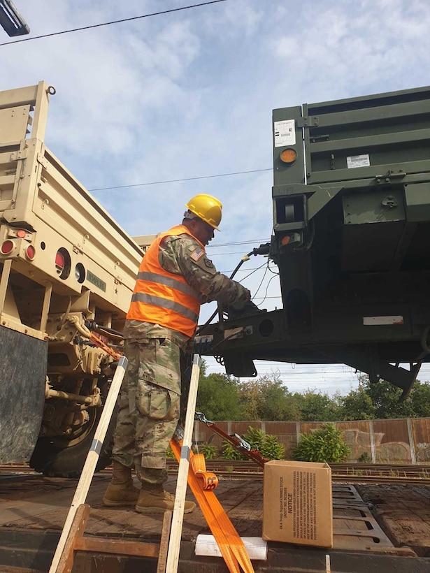 U.S. Army Reserve Sgt. Fabio Gaviria of the 793rd Movement Control Team, 446th Movement Control Battalion, 510th Regional Support Group, 7th Mission Support Command, removes satellite tags from equipment shipped by rail from Bergen-Hohne to Coleman Barracks, Germany, Sept. 13, 2020.  MCT Soldiers under the 446th tracked more than 2,600 pieces of redeployed equipment to close out their support to DEFENDER-Europe 20 Plus. (U.S. Army Reserve photo by Staff Sgt. Christopher Pelican)