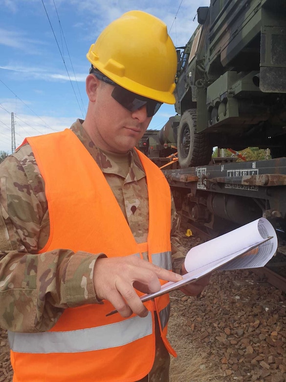 U.S. Army Reserve Spc. Erik Stoops of the 530th Movement Control Team, 446th Movement Control Battalion, 510th Regional Support Group, 7th Mission Support Command, verifies a manifest of equipment shipped by rail from Bergen-Hohne to Coleman Barracks, Germany, Sept. 13, 2020.  MCT Soldiers under the 446th tracked more than 2,600 pieces of redeployed equipment to close out their support to DEFENDER-Europe 20 Plus. (U.S. Army Reserve photo by Staff Sgt. Christopher Pelican)