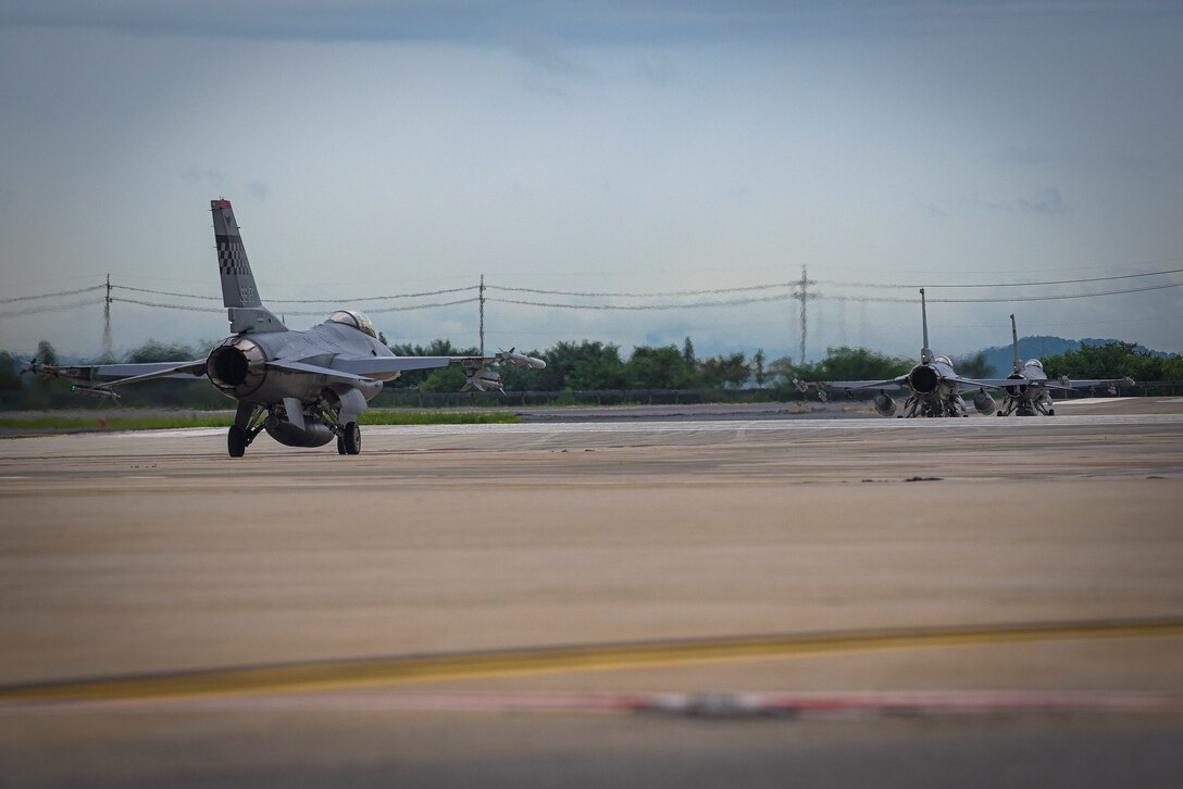 U.S. Air Force Col. Henry R. Jeffress III, 51st Fighter Wing vice commander, taxis behind 36th Fighter Squadron F-16 Fighting Falcon pilots during his debut flight as ‘Mustang 2,” at Osan Air Base, Republic of Korea, Sept. 2, 2020. The Emporia, Va., native joins Osan after being the director of U.S. Strategic Command’s Joint Electromagnetic Preparedness for Advanced Combat (JEPAC) Directorate. (U.S. Air Force photo by Staff Sgt. Greg Nash)