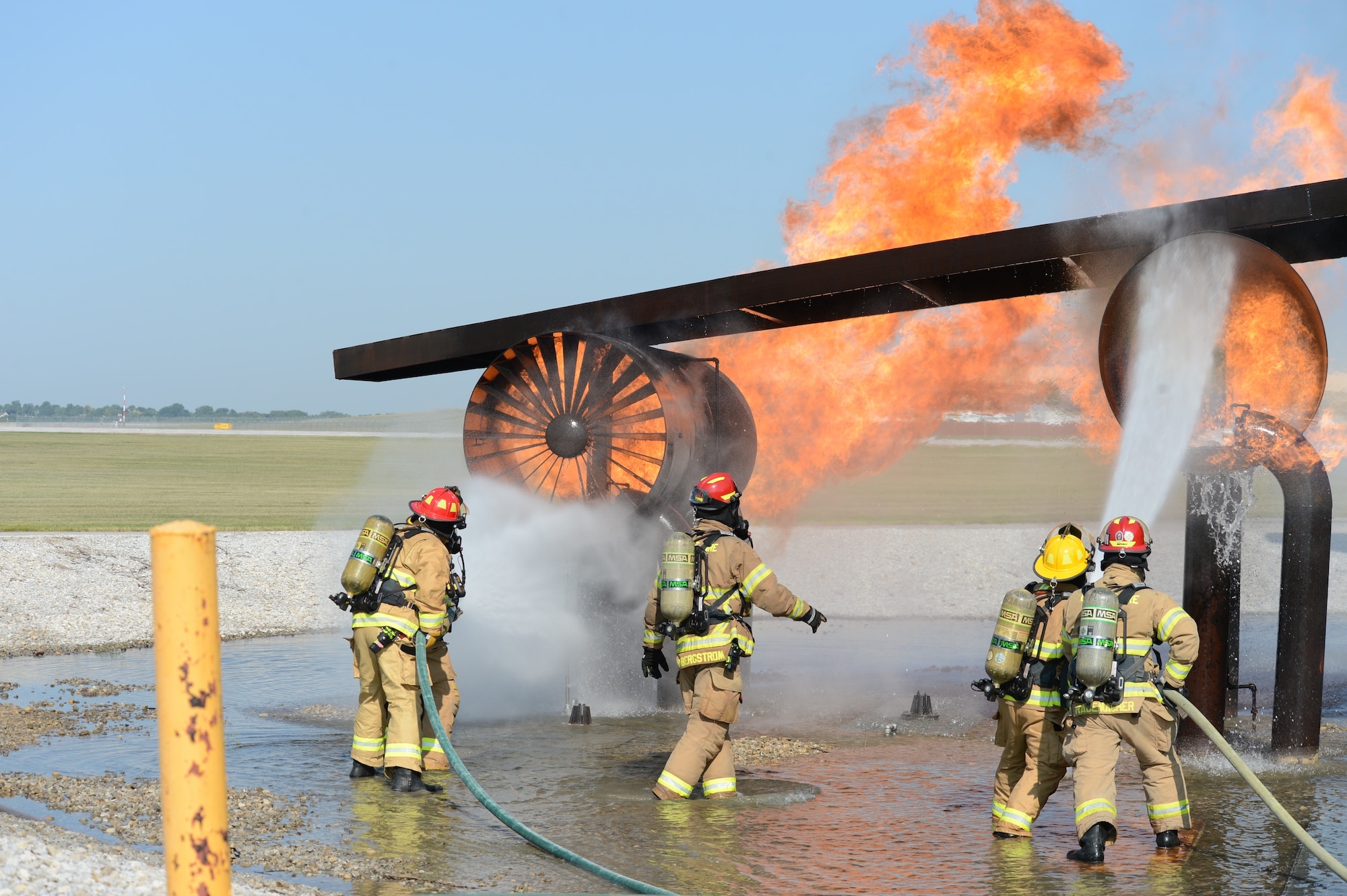 Four new firefighters with the Nebraska Air National Guard Base Fire Department receive training on Aircraft Rescue Firefighter (ARFF) operations, Aug. 26, 2020, at Offutt Air Force Base in Bellevue, Neb.  Since firefighter schools closed for COVID-19 concerns, the Nebraska Air National Guard decided to conduct the required training on its own in Lincoln and at Offutt Air Force Base for the newly-hired firefighters. (Nebraska Air National Guard photo by Tech. Sgt. R. Denise Mommens)