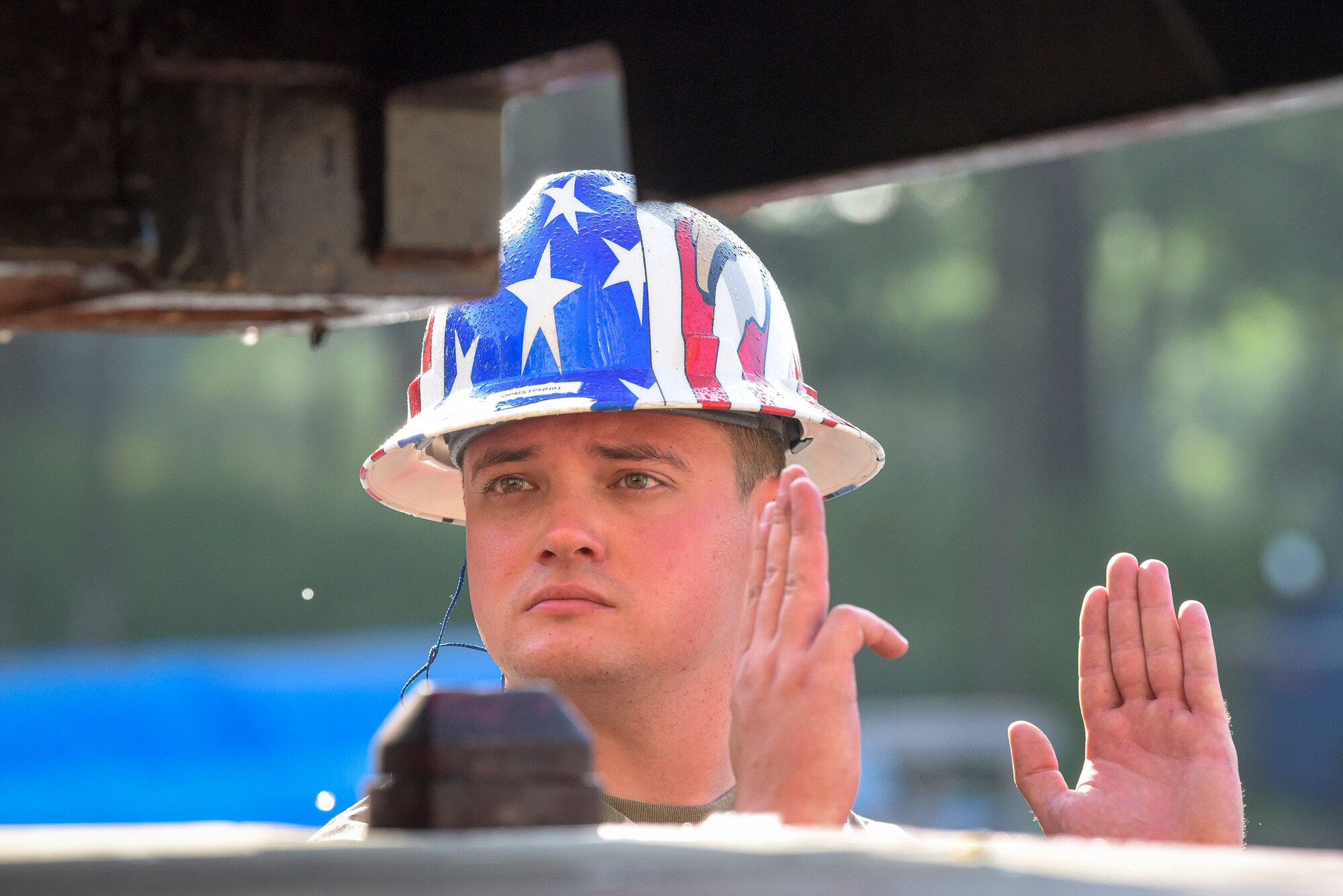 Staff Sgt. Joshua Walker, 51st Munitions Squadron shipping/receiving element crew chief, helps direct cargo transport alongside 51st Logistics Readiness Squadron personnel prior to a retrograde in support of operation “ammo transfer,” Aug. 25, 2020, in Pyeongtaek-si, Republic of Korea. The squadrons transported excess serviceable assets valued at $13 million to Jinhae Port, Jinhae-gu, Republic of Korea, for international maritime shipping. (U.S. Air Force photo by Staff Sgt. Greg Nash)