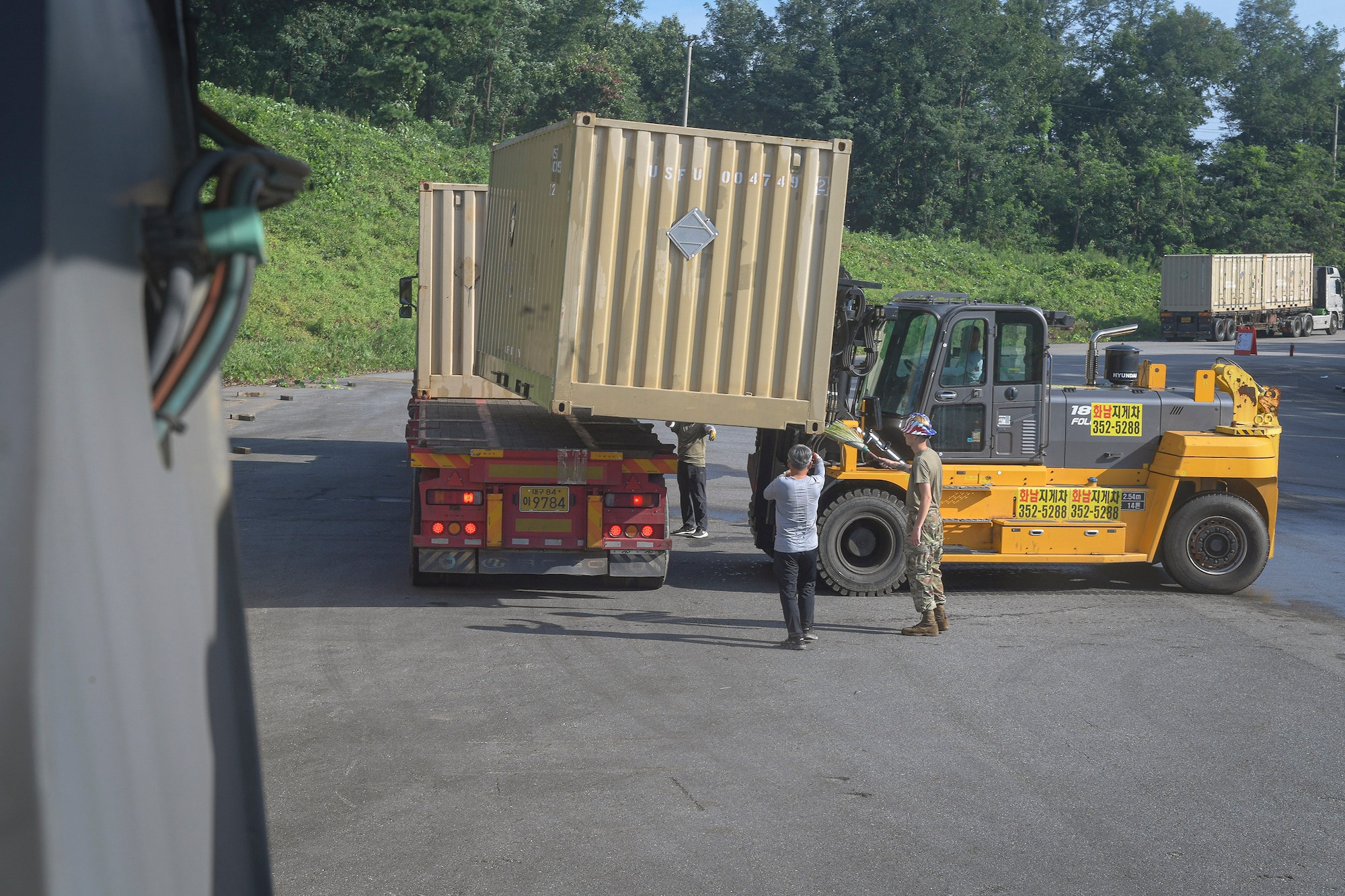 Airmen from the 51st Munitions Squadron and 51st Logistics Readiness Squadron personnel prepare to deliver excess ammunition en-route to Jinhae Port during a Retrograde ISO Operation “ammo transfer,” Aug. 25, 2020, in Pyeongtaek-si, Republic of Korea. The squadrons transported excess serviceable assets valued at $13 million to Jinhae Port, Jinhae-gu, Republic of Korea, for international maritime shipping. (U.S. Air Force photo by Staff Sgt. Greg Nash)