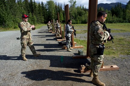 Alaska Air National Guard Tech. Sgt. Brian Sears, a combat arms training and maintenance instructor with 176th Security Forces Squadron, coaches Airmen of 176th SFS in M4 carbine marksmanship skills Aug. 27, 2020, at Joint Base Elmendorf-Richardson. CATM instructors are specially trained Security Forces Defenders who train others to ably employ small arms.
