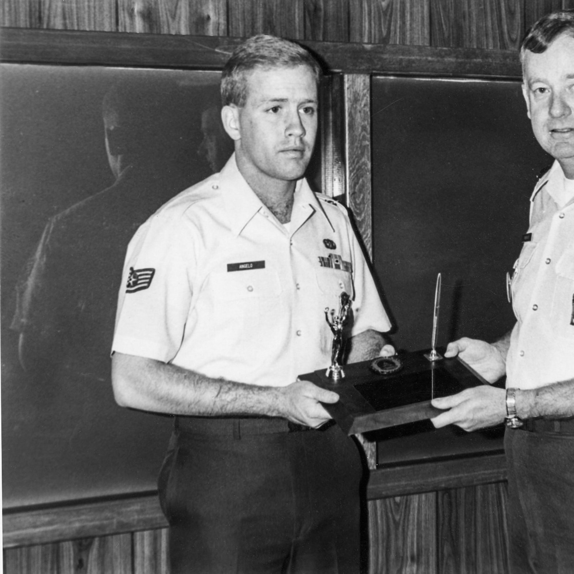 Then Staff Sgt. Jack Angelo, an Agent Trainee at Office of Special Investigations Detachment 2006, Malmstrom Air Force Base, Mont., receives the John Levitow Honor Graduate Award from the Leadership School's 341st Missile Wing commander in July 1986. The event was publicized in the base newspaper. (Courtesy photo)