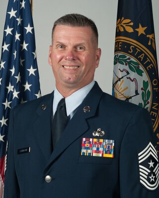 Offical Portrait of U.S. Air Force Chief Master Sgt. John Symington, the New Hampshire Air National Guard's 12th state command chief, June 28, 2019, Pease Air National Guard Base, N.H. (U.S. Air National Guard photo by Tech. Sgt. Aaron P. Vezeau)