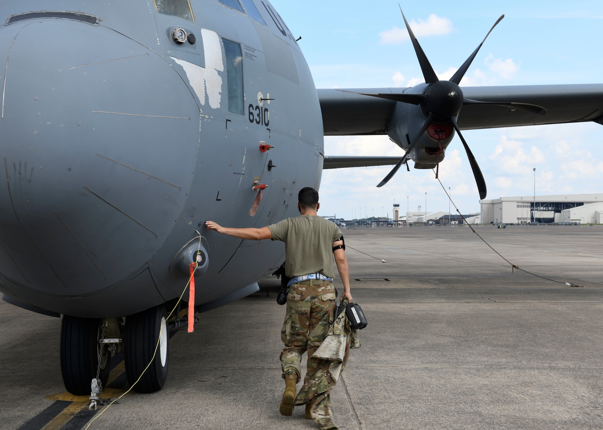U.S. Air Force Reserve Airman 1st Class Micco Moore, 913th Aircraft Maintenance Squadron crew chief, touches the nose of a C-130J Super Hercules at Little Rock Air Force Base, Ark., Sept. 10, 2020.
