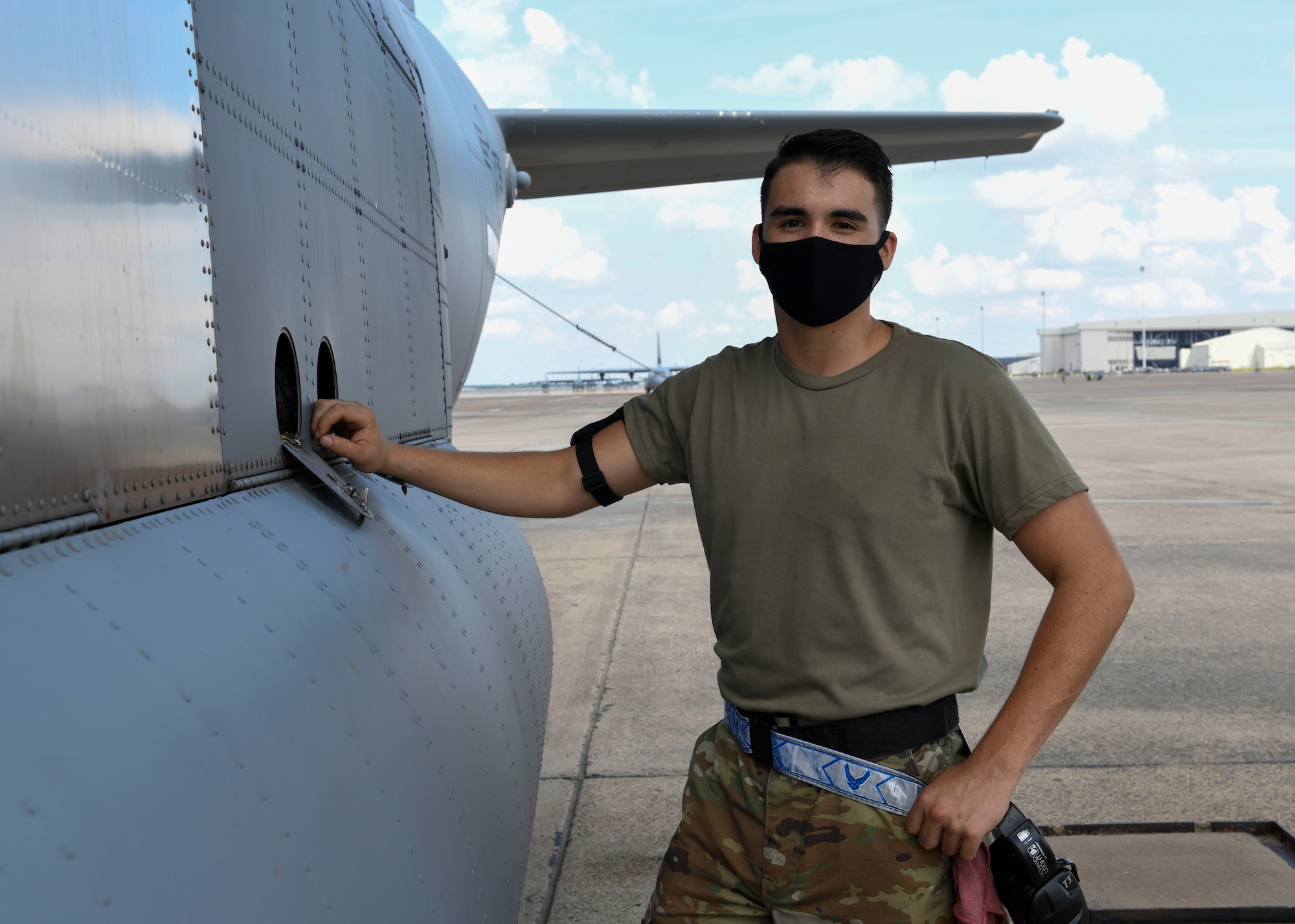 U.S. Air Force Reserve Airman 1st Class Micco Moore, 913th Aircraft Maintenance Squadron crew chief, stands next to a C-130J Super Hercules at Little Rock Air Force Base, Ark., Sept. 10, 2020.