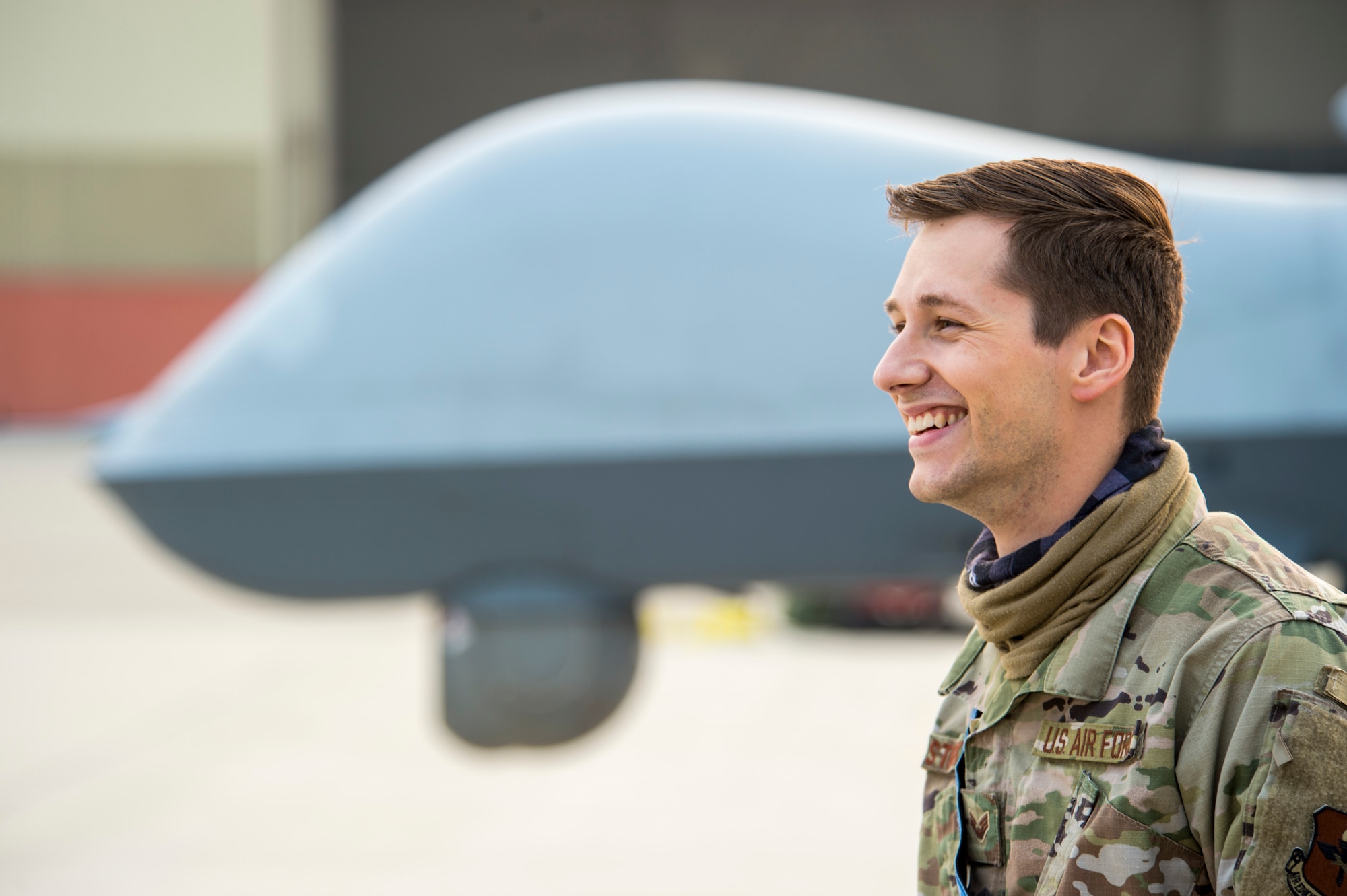 Senior Airman Zachary Stricklett, 9th Aircraft Maintenance Unit avionics expeditor, smiles during Exercise Agile Reaper, Sept. 15, 2020, at Naval Air Station Point Mugu, California. This routine training exercise focuses on the rapid deployment of MQ-9 Reapers to a maritime location using minimal personnel, fuel and equipment and reducing deployment timelines from weeks to a few hours.  (U.S. Air Force photo by Senior Airman Collette Brooks)