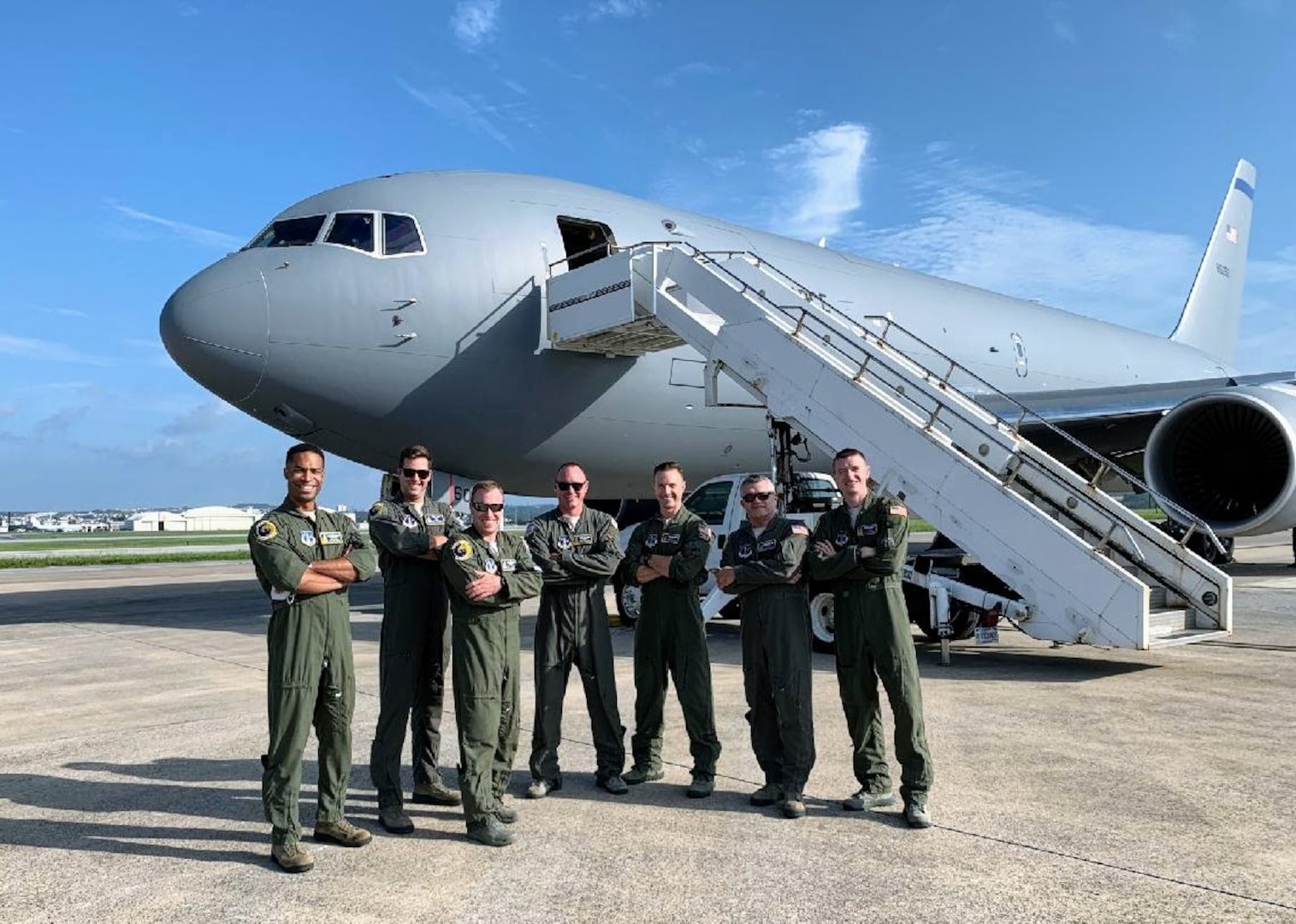 From left, Capt. Erik Earle, Capt. Chris Schimmel, Maj. Matt Valentino, Master Sgt. Brett Peterson, Capt. Jordan Gauvin, Chief Master Sgt. Michael George and Maj. Leon Rice stand with a KC-46A Pegasus on Sept. 8, 2020, at Kadena Air Base, Japan.