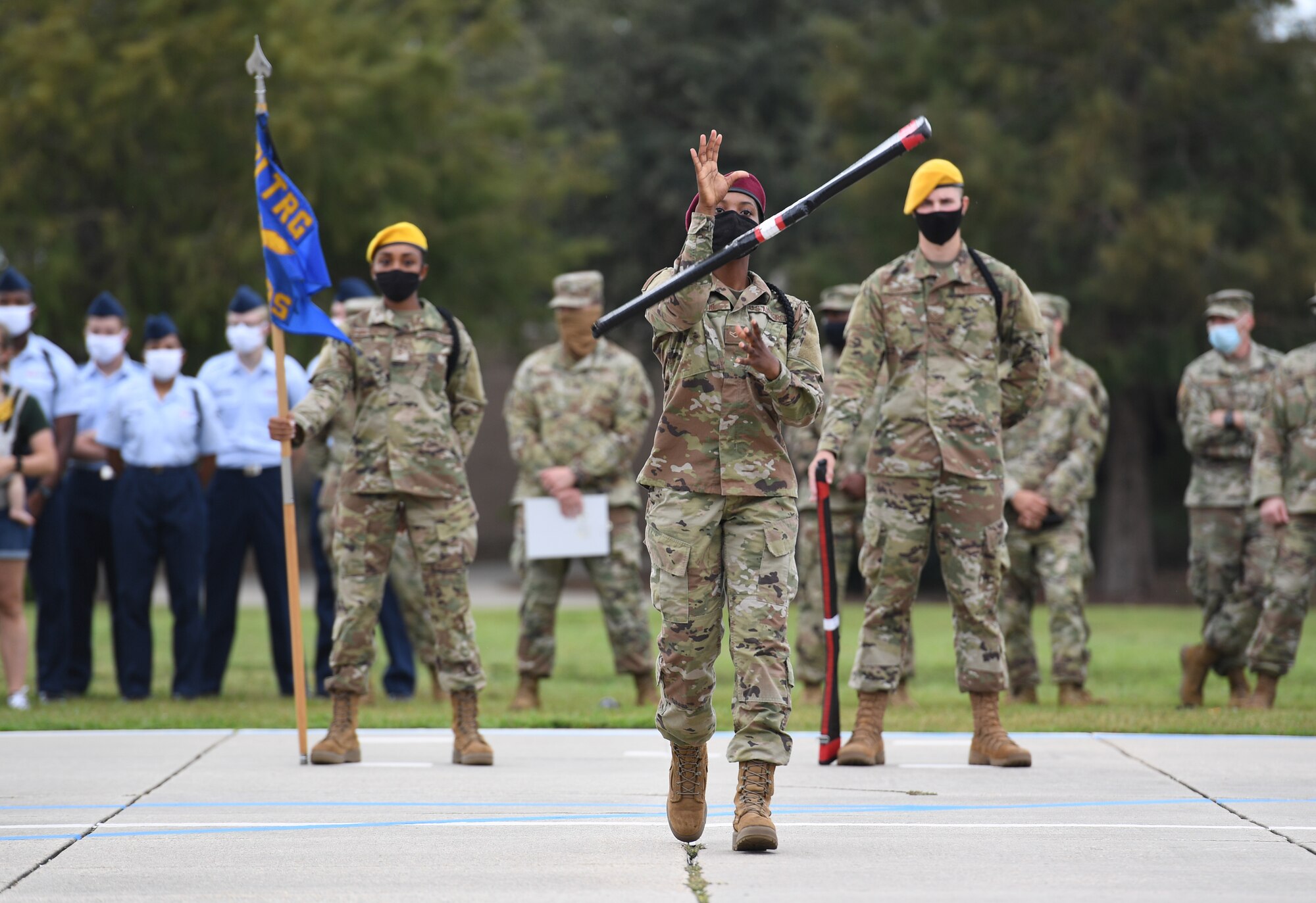 U.S. Air Force Airman Raven Davis, 335th Training Squadron freestyle drill team member, performs during the 81st Training Group drill down on the Levitow Training Support Facility drill pad at Keesler Air Force Base, Mississippi, Sept. 18, 2020. Airmen from the 81st TRG competed in a quarterly open ranks inspection, regulation drill routine and freestyle drill routine. Keesler trains more than 30,000 students each year. While in training, Airmen are given the opportunity to volunteer to learn and execute drill down routines. (U.S. Air Force photo by Kemberly Groue)