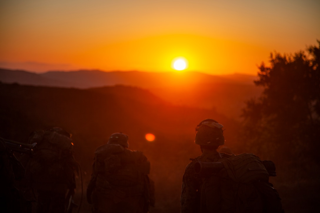 U.S. Marines hike after conducting an aerial assault at Marine Corps Base Camp Pendleton, Calif., Aug. 7.