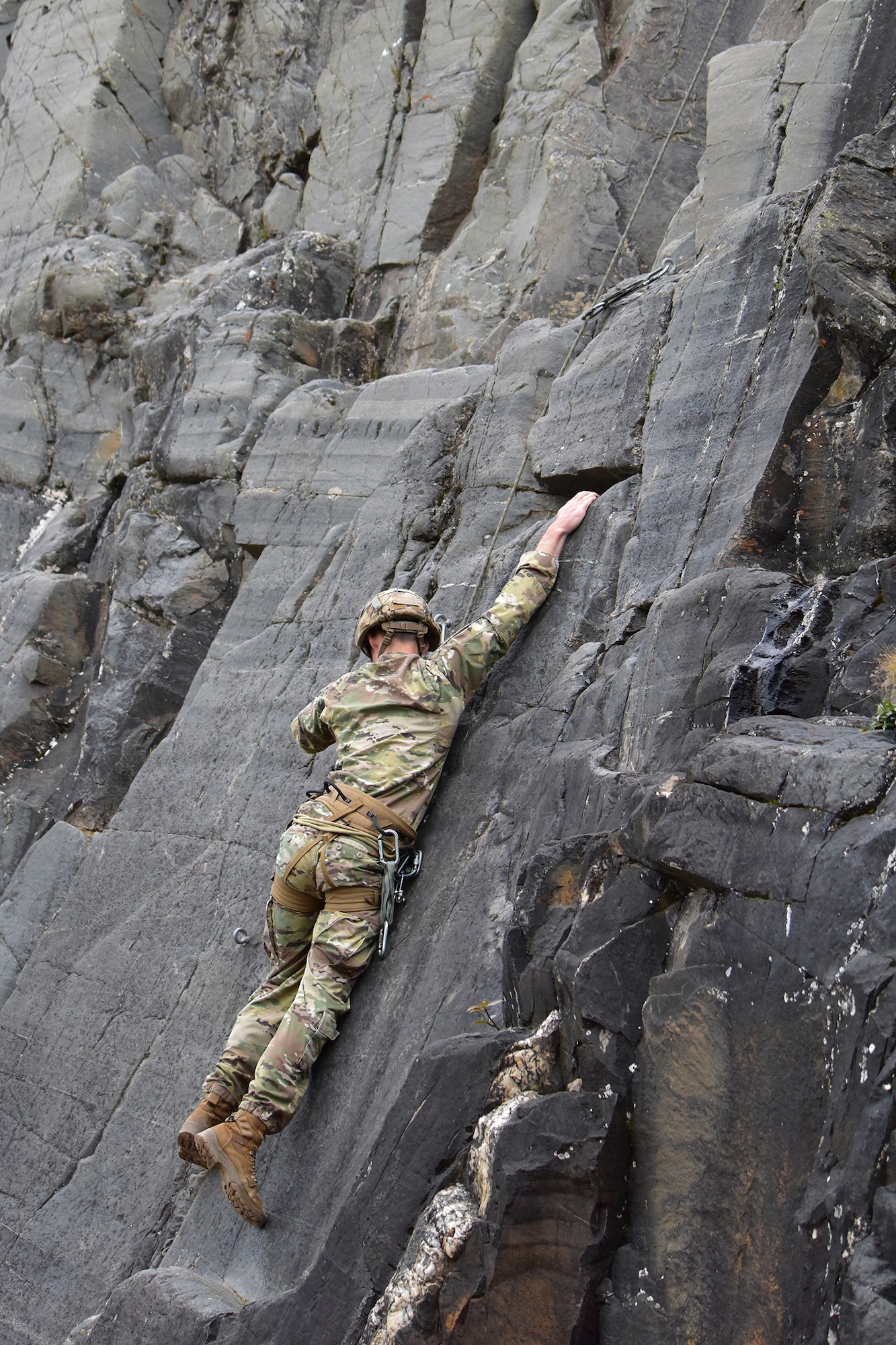 An Advanced Military Mountaineering Course student searches for a route up a rock face at the Northern Warfare Training Center’s Black Rapids Site during training. NWTC cadre followed Coronavirus restrictions while guiding students through both the basic and advanced mountaineering courses in August. With the advent of Alaska’s long, cold winter, NWTC’s focus is now shifting to cold weather training for the 2020-21 season.