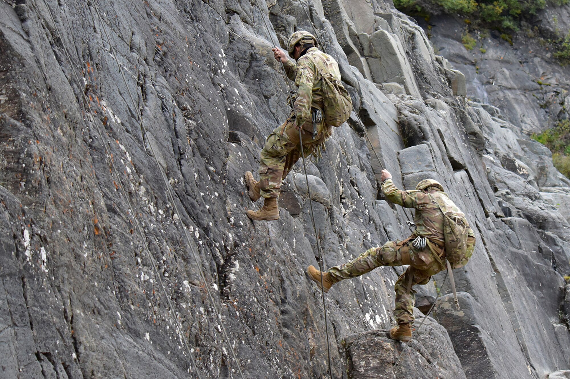 A pair of Advanced Military Mountaineering Course students rappel down a rock face at the Northern Warfare Training Center’s Black Rapids Site during training. NWTC cadre followed Coronavirus restrictions while guiding students through both the basic and advanced mountaineering courses in August. With the advent of Alaska’s long, cold winter, NWTC’s focus is now shifting to cold weather training for the 2020-21 season.