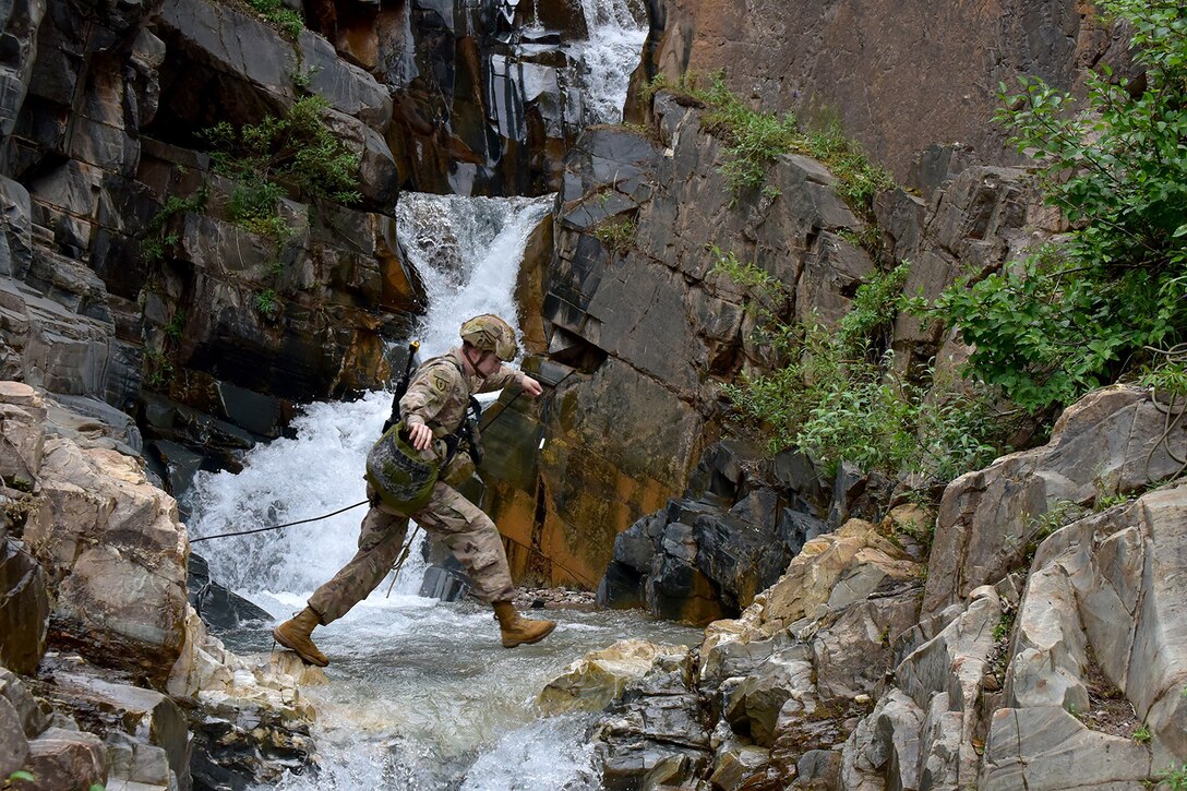 Basic Military Mountaineering Course student 1st Lt. Christopher Peer crosses a stream at the Northern Warfare Training Center’s Black Rapids Site during training. NWTC cadre followed Coronavirus restrictions while guiding students through both the basic and advanced mountaineering courses in August. With the advent of Alaska’s long, cold winter, NWTC’s focus is now shifting to cold weather training for the 2020-21 season.