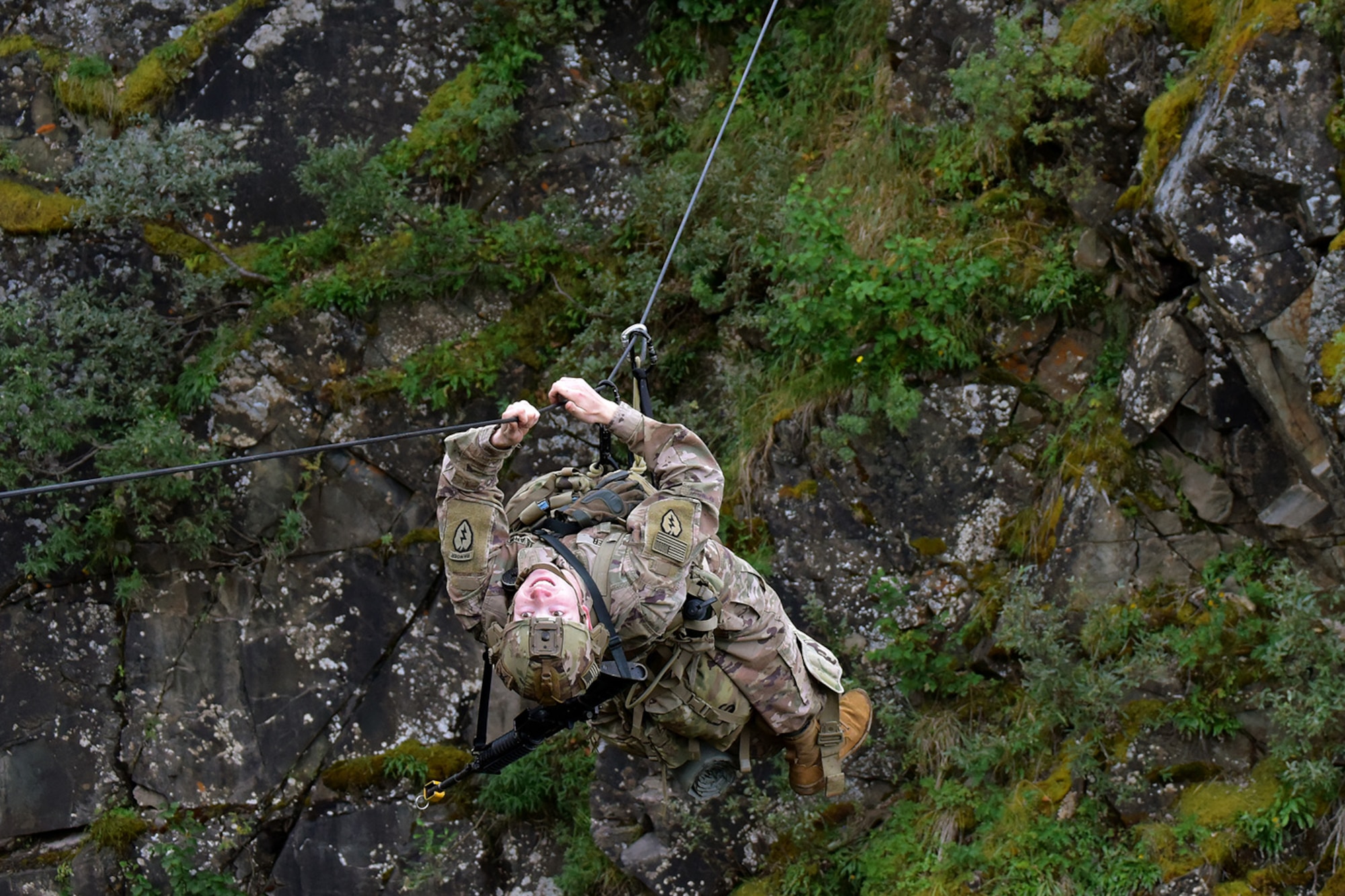 Basic Military Mountaineering Course student 1st Lt. Christopher Peer crosses a one-rope bridge over a mountain gorge at the Northern Warfare Training Center’s Black Rapids Site during training. NWTC cadre followed Coronavirus restrictions while guiding students through both the basic and advanced mountaineering courses in August. With the advent of Alaska’s long, cold winter, NWTC’s focus is now shifting to cold weather training for the 2020-21 season.
