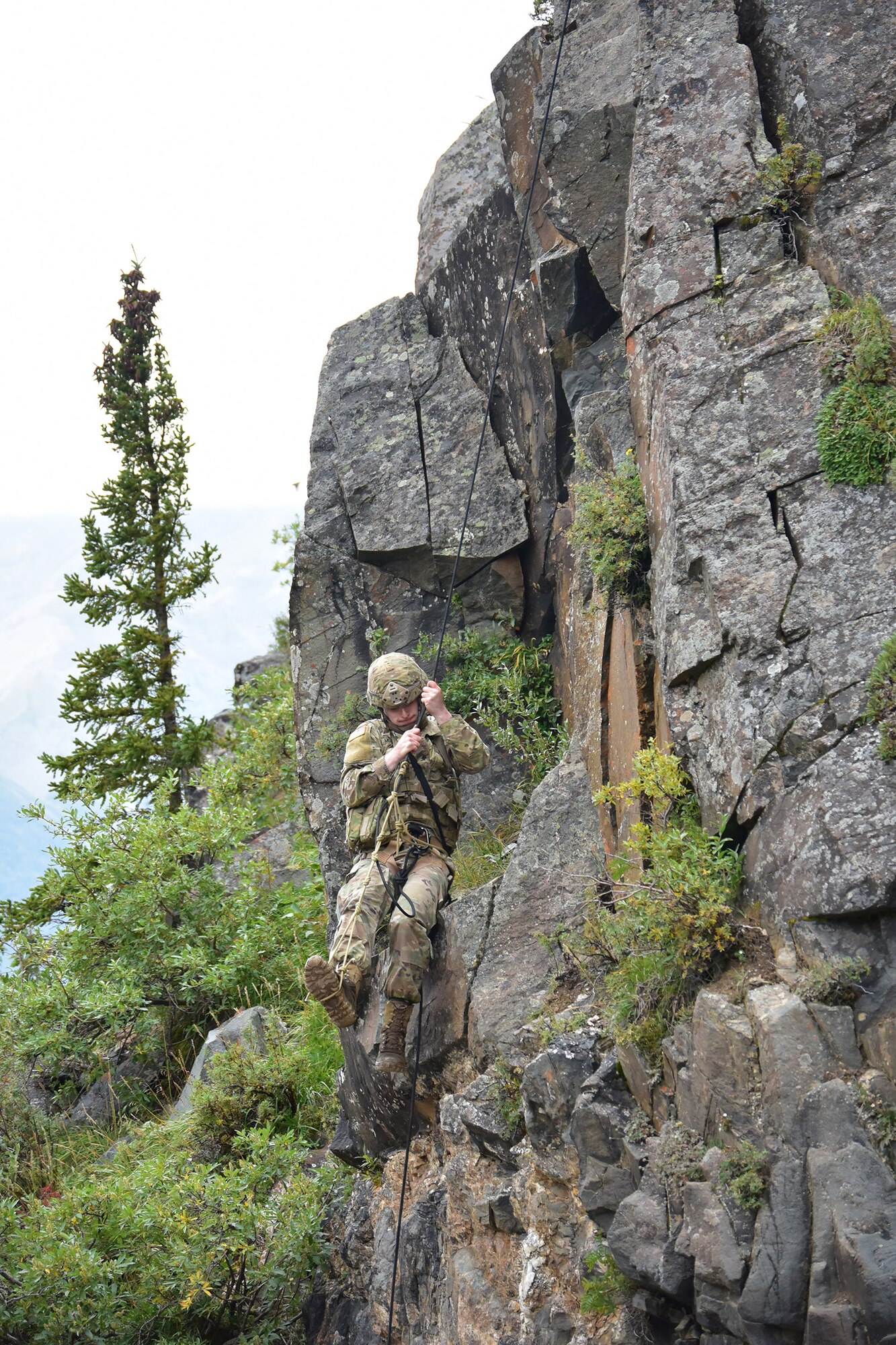 Spc. Michael John McConville uses a Prusik friction hitch to haul himself up a rock face at the Northern Warfare Training Center’s Black Rapids Site during training. NWTC cadre followed Coronavirus restrictions while guiding students through both the basic and advanced mountaineering courses in August. With the advent of Alaska’s long, cold winter, NWTC’s focus is now shifting to cold weather training for the 2020-21 season.